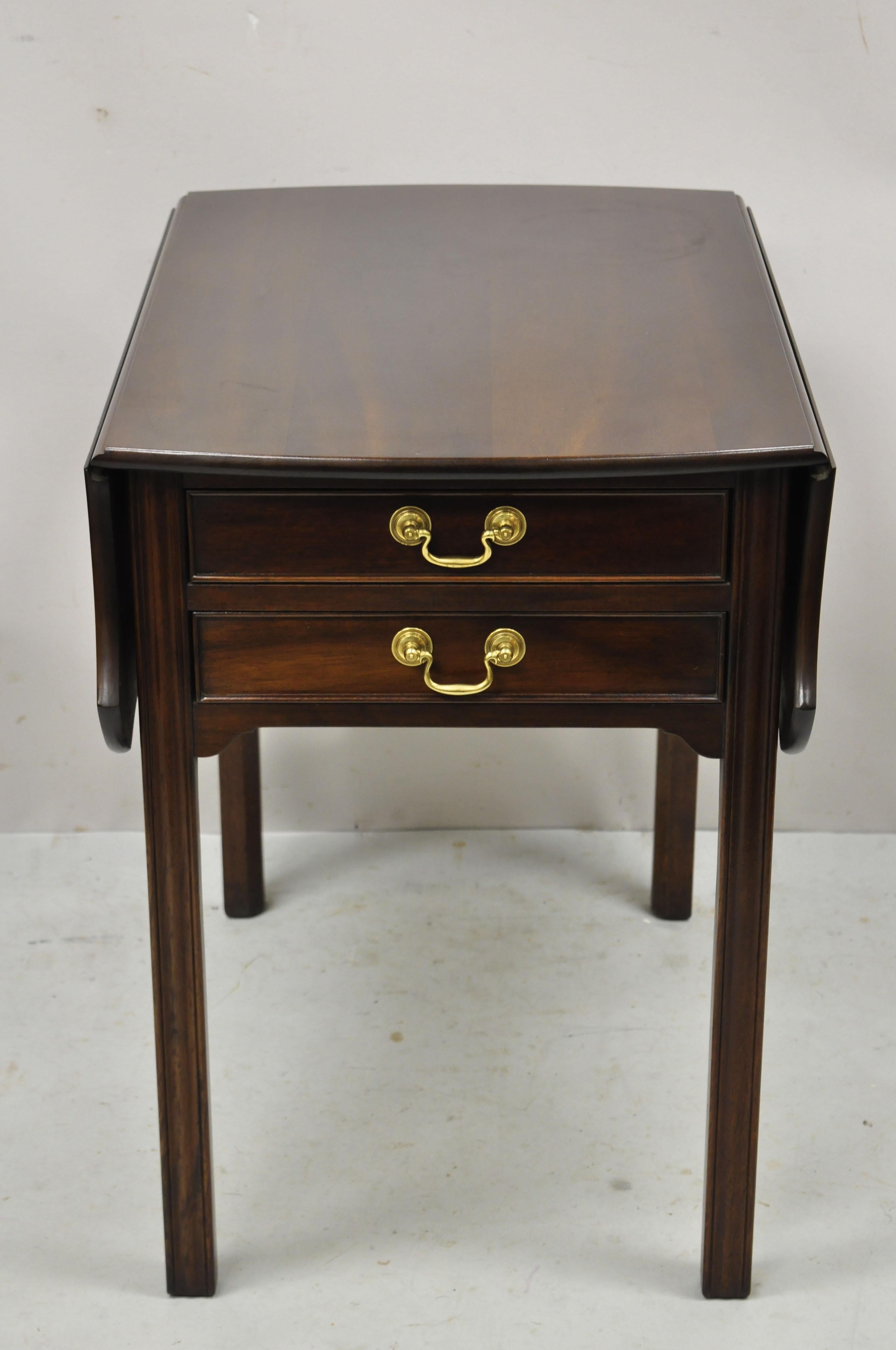 L & J G Stickley Georgian solid mahogany drop leaf pembroke lamp side table. Item features solid wood construction, beautiful wood grain, finished back, original label, 2 dovetailed drawers, quality American craftsmanship, great style and form.