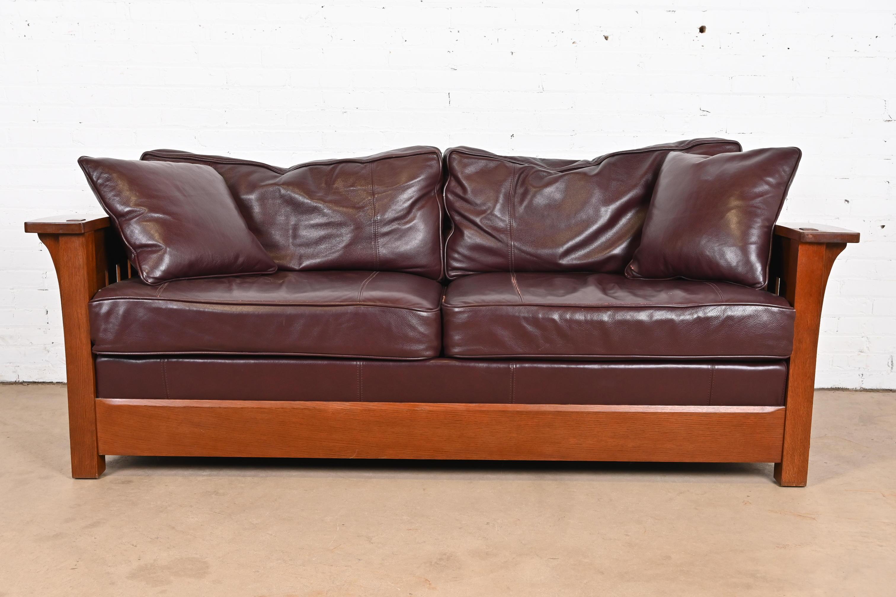 A gorgeous Mission, Arts & Crafts, or Prairie style full size sleeper sofa or loveseat

By L. & J. G. Stickley

USA, Circa Late 20th Century

Solid quarter sawn oak frame, with leather upholstery.

Measures: 82.5