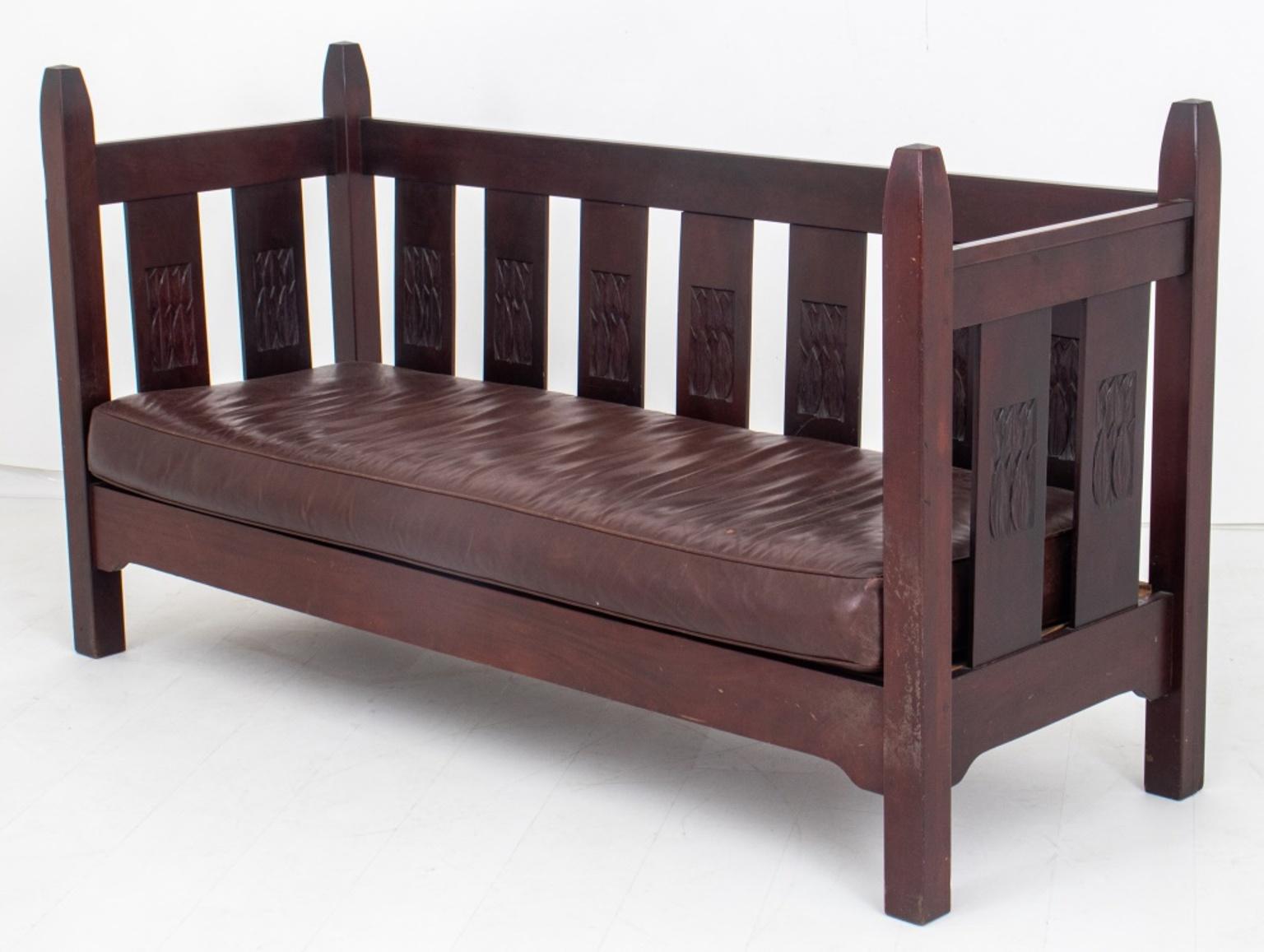 L. J.G. Stickley Arts & Crafts settee, ca. 1905-1907, rectangular, the four corners with tapering posts and relief-carved back splats with floral carved motifs, the sprung seat with leather cushion. Provenance: David Rago Arts & Crafts,