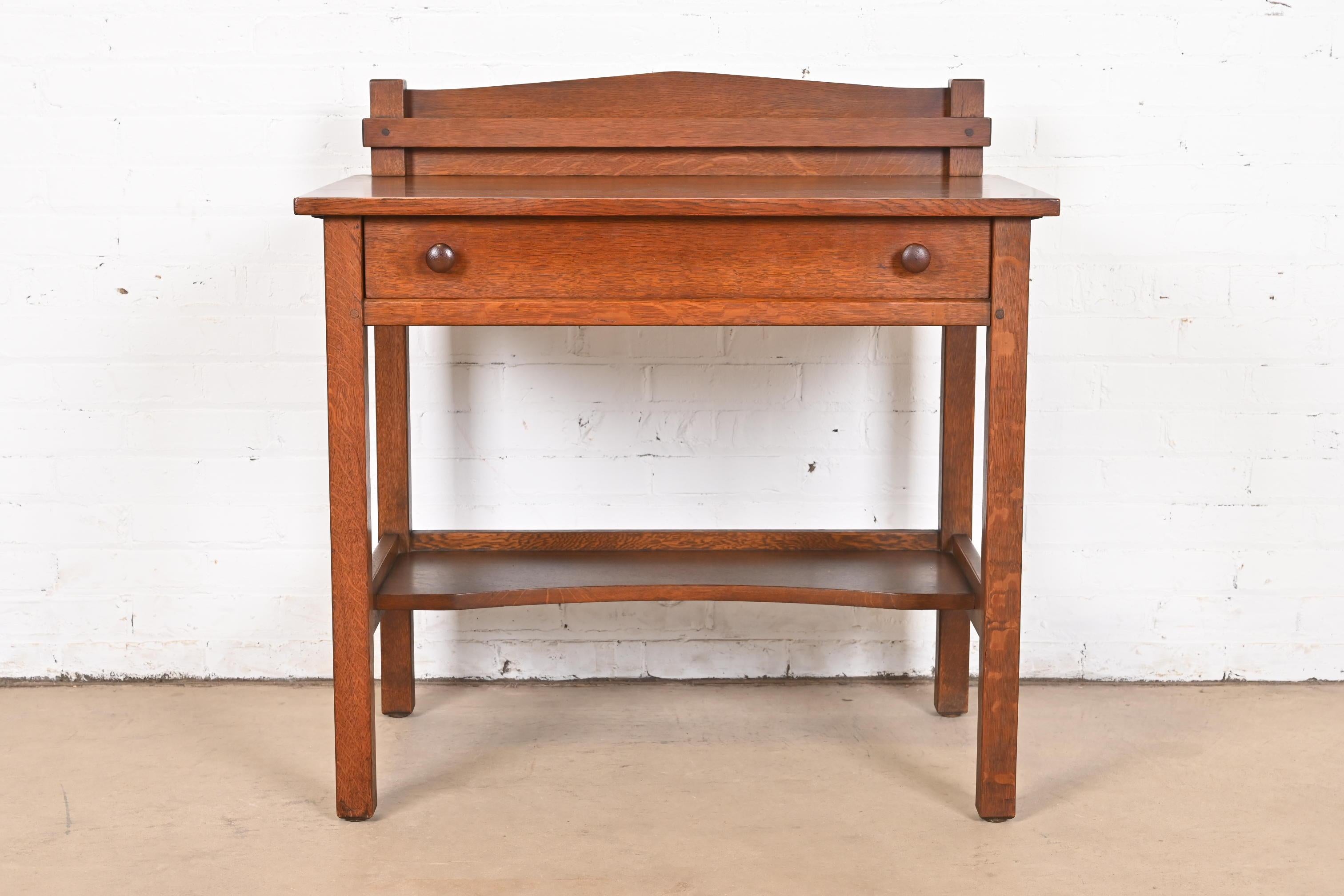 An exceptional antique Mission or Arts & Crafts quarter sawn oak sideboard buffet server or writing desk 

By L. & J.G. Stickley

USA, Circa 1900

Measures: 34