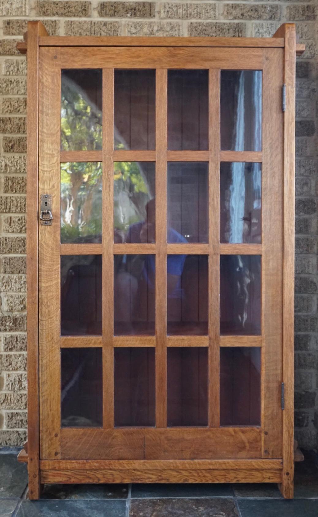 L & LG Stickley Oak Bookcase. Circa 1910
A single 16 pane glass window door bookcase with mortise and tenon oak wood construction is wonderful condition with a beautiful finish ready to complete your arts and crafts  Gustave Stickley