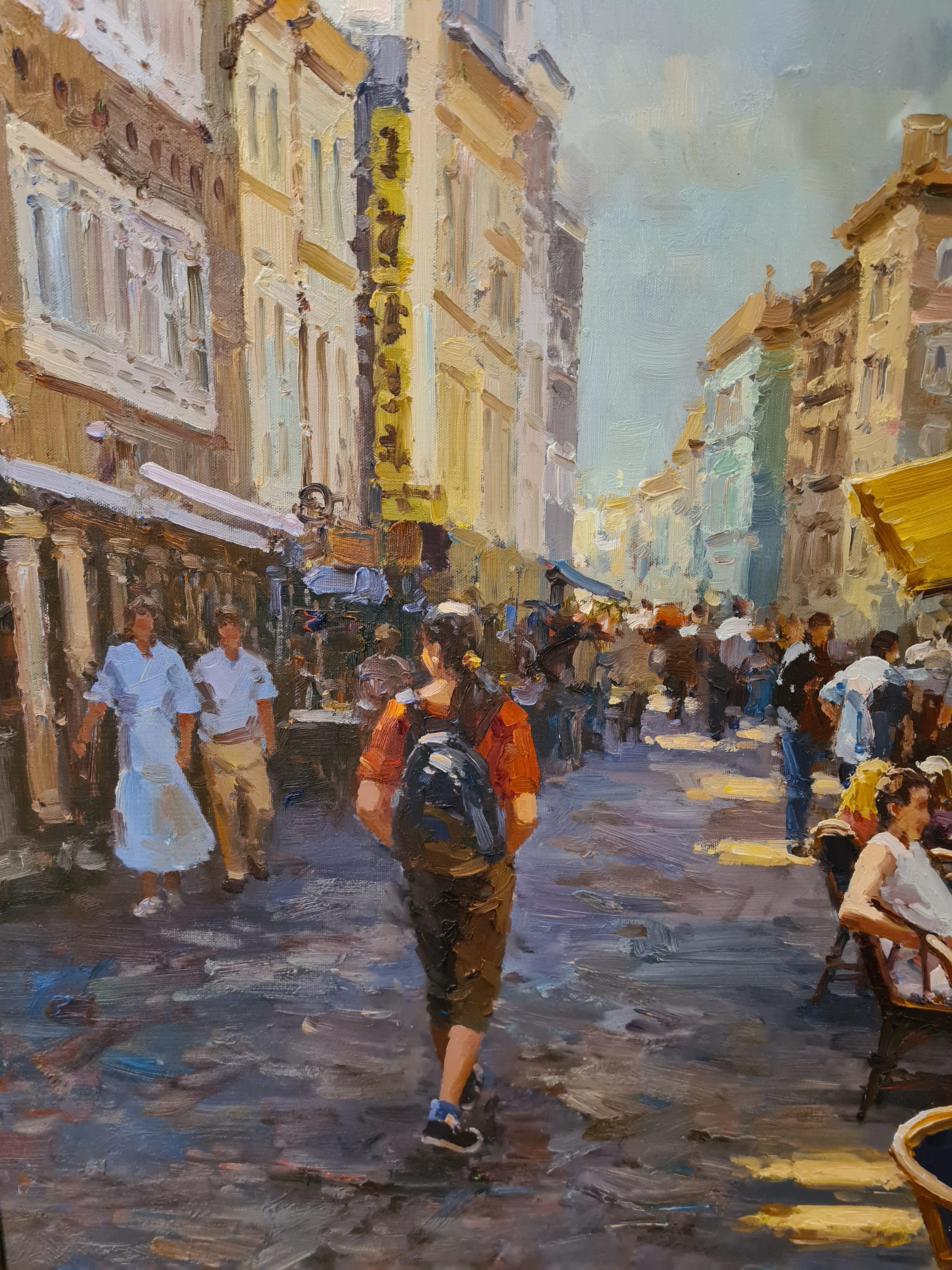 Late 20th Century large oil on canvas view of a Parisian café by L Joyce. Signed bottom left, presented in patinated moulded frame. This painting is one of a pair and the other is available separately here on 1stDibs.

A bright and colourful