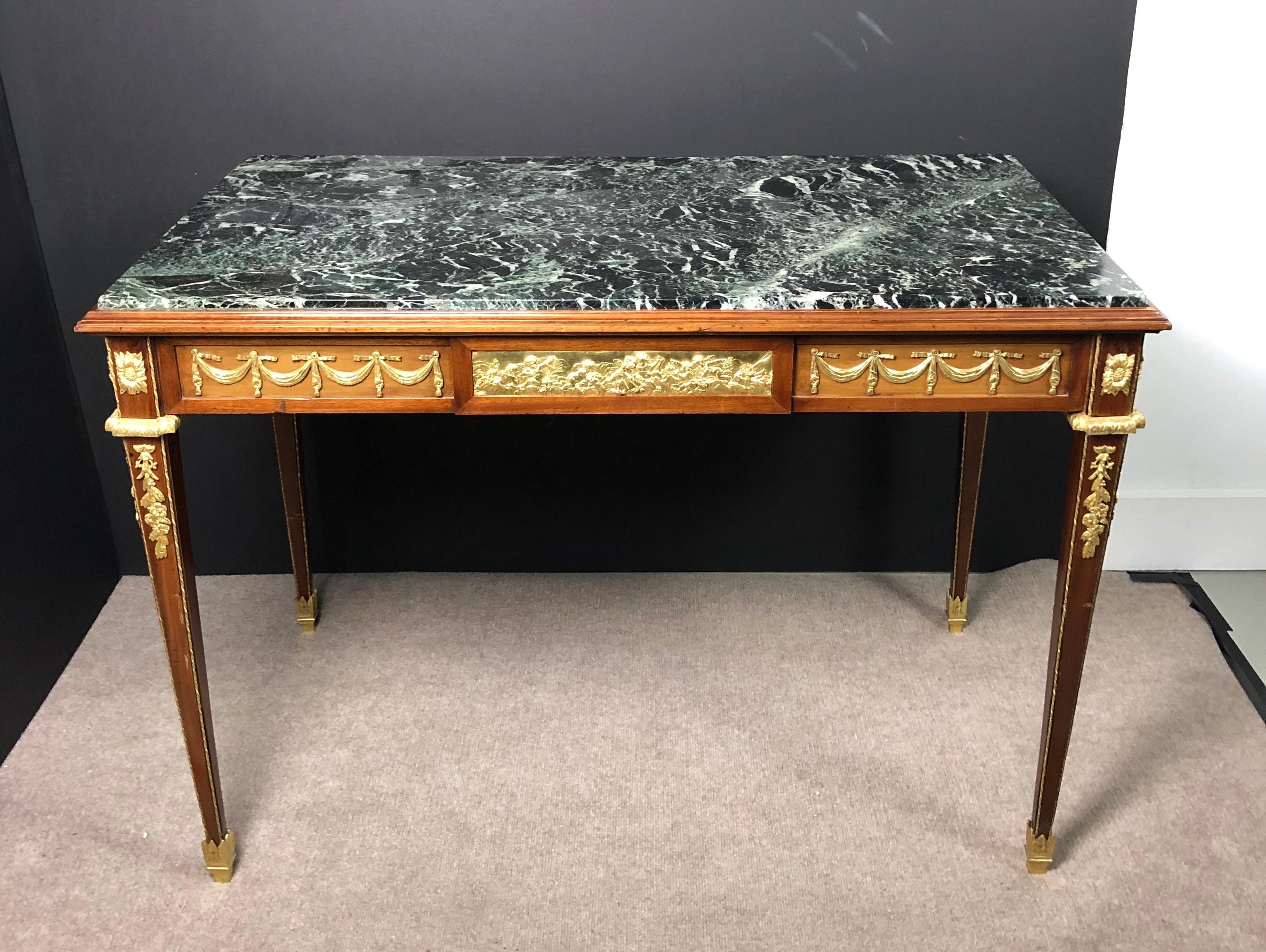 Signed L. Kahn Louis XVI style green marble-top Doré bronze mounted library table, 19th century Louis XVI marble top Doré bronze mounted writing table. Green and white marble top desk with signed gilt bronze mounts. Neoclassical style. Table has