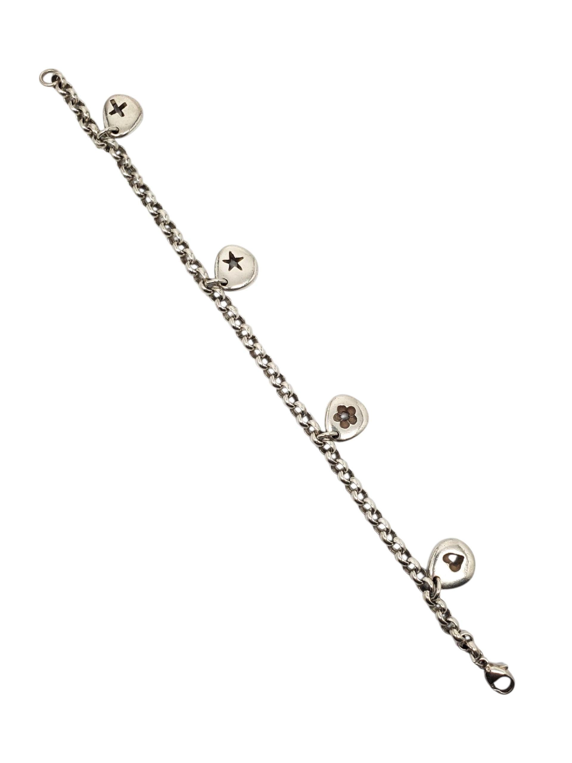 L & N Sterling Silber Dangle Link Charm Armband -

Diese Vintage Sterling Silber Link Charm Armband von L & N verfügt über ein Herz, Stern, Klee & Kreuz Ausschnitt Reize mit einem Karabinerverschluss.

Größe: passt bis zu 7