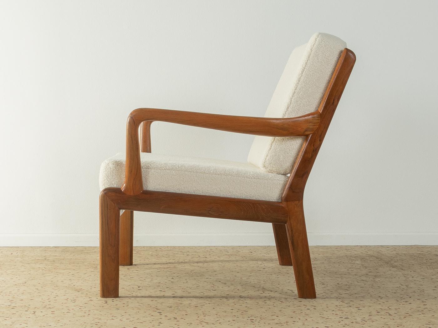 Rare armchair from the 1960s from L. Olsen & Søn. High-quality solid teak wood frame. The seat and backrest have been reupholstered and covered with a classic teddy fabric in off white.

Quality Features:
 accomplished design: perfect