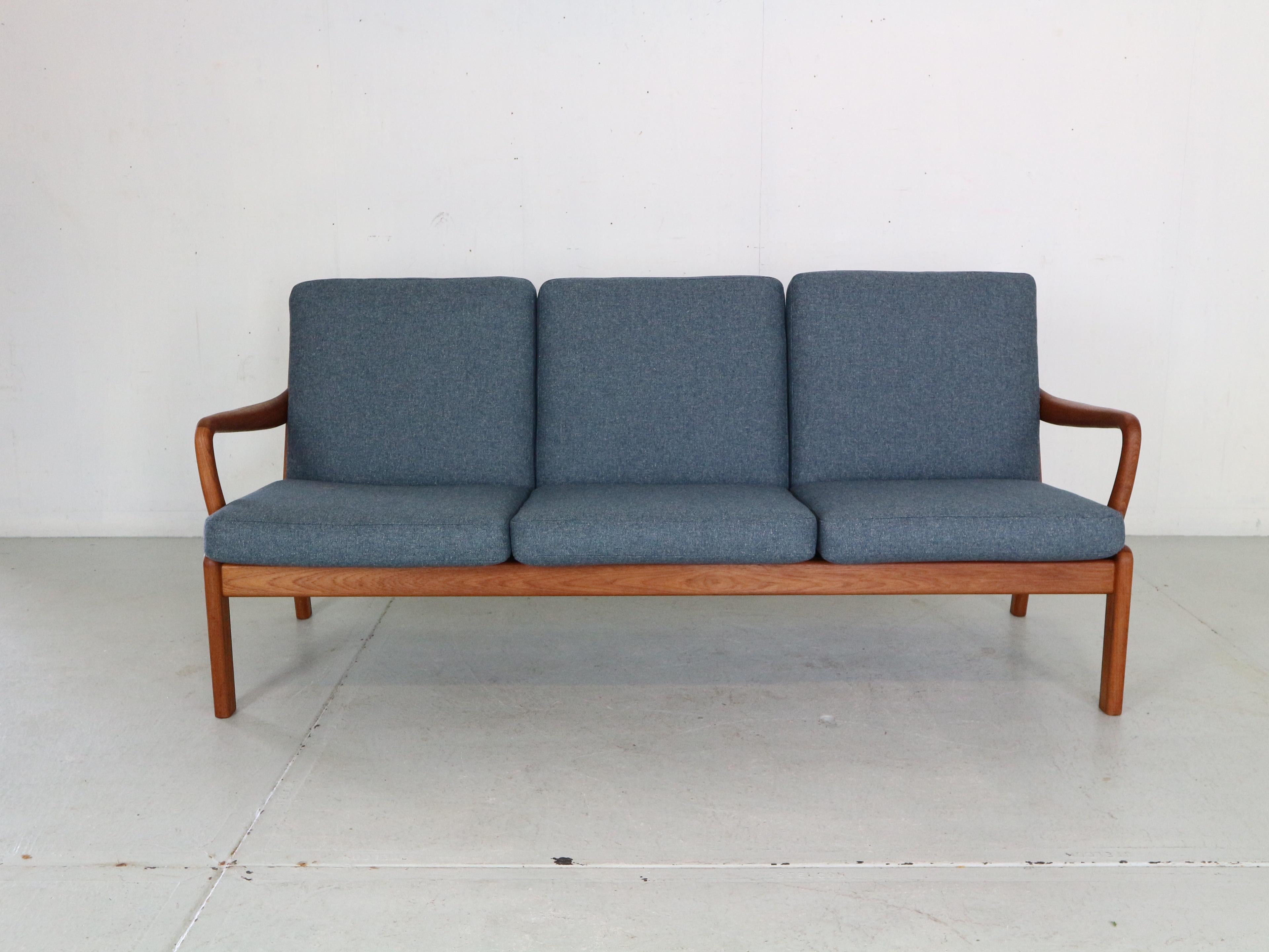 Gorgeous Danish Modern three-seater sofa designed and manufactured by L. Olsen & Son. 
Featuring the typical organic 1960s Danish design, solid teak frame, high quality newly reupholstered in blue colour wool fabric.
Excellent seating comfort and