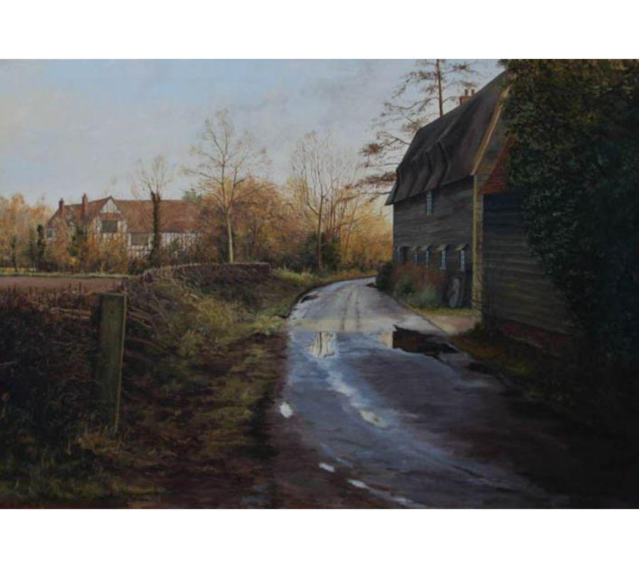A very accomplished oil of a substantial size showing a country lane with shafting sunlight after the rain. The artist shows great skill as shown in the reflections in the puddles and the exact, fine detail in the thatched cottage.

This very large