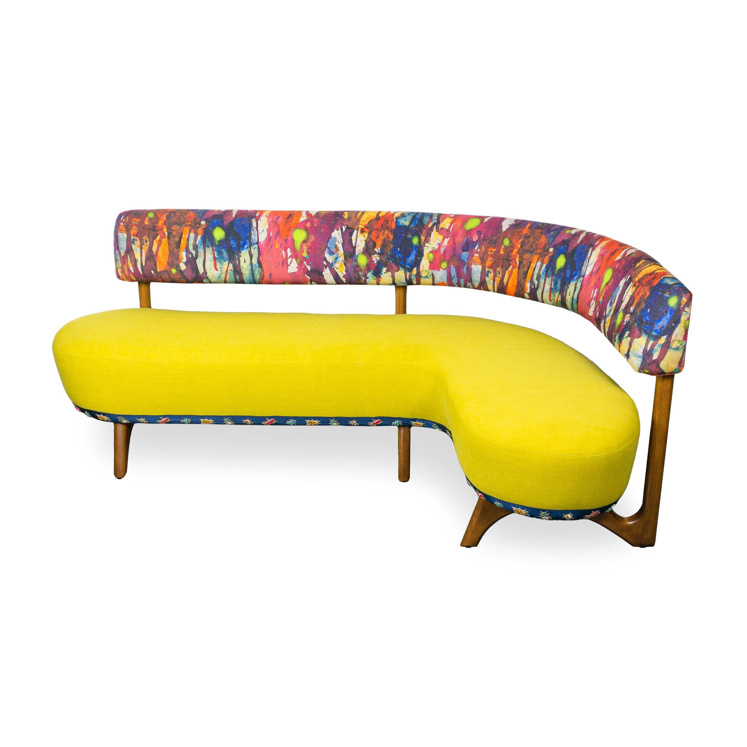 Dimensions, fabric and finish are customizable, just ask.
L-shaped banquette with exposed wood frame (maple) and upholstered with a multicolor watercolor linen on back rail and yellow linen on seat, plus embroidered beaded insect trim along base.