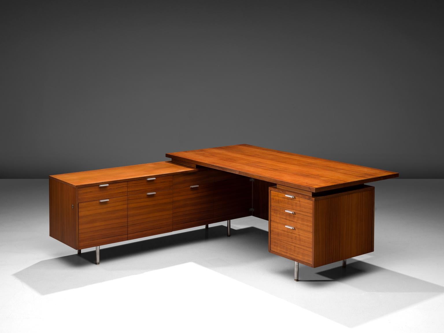 George Nelson for Herman Miller Zeeland Michigan, L- Shaped desk, walnut, metal, United States, 1960s. 

This L-Shaped architectural desk in walnut presents a dynamic combination between the different storage units. This desk is a great example of