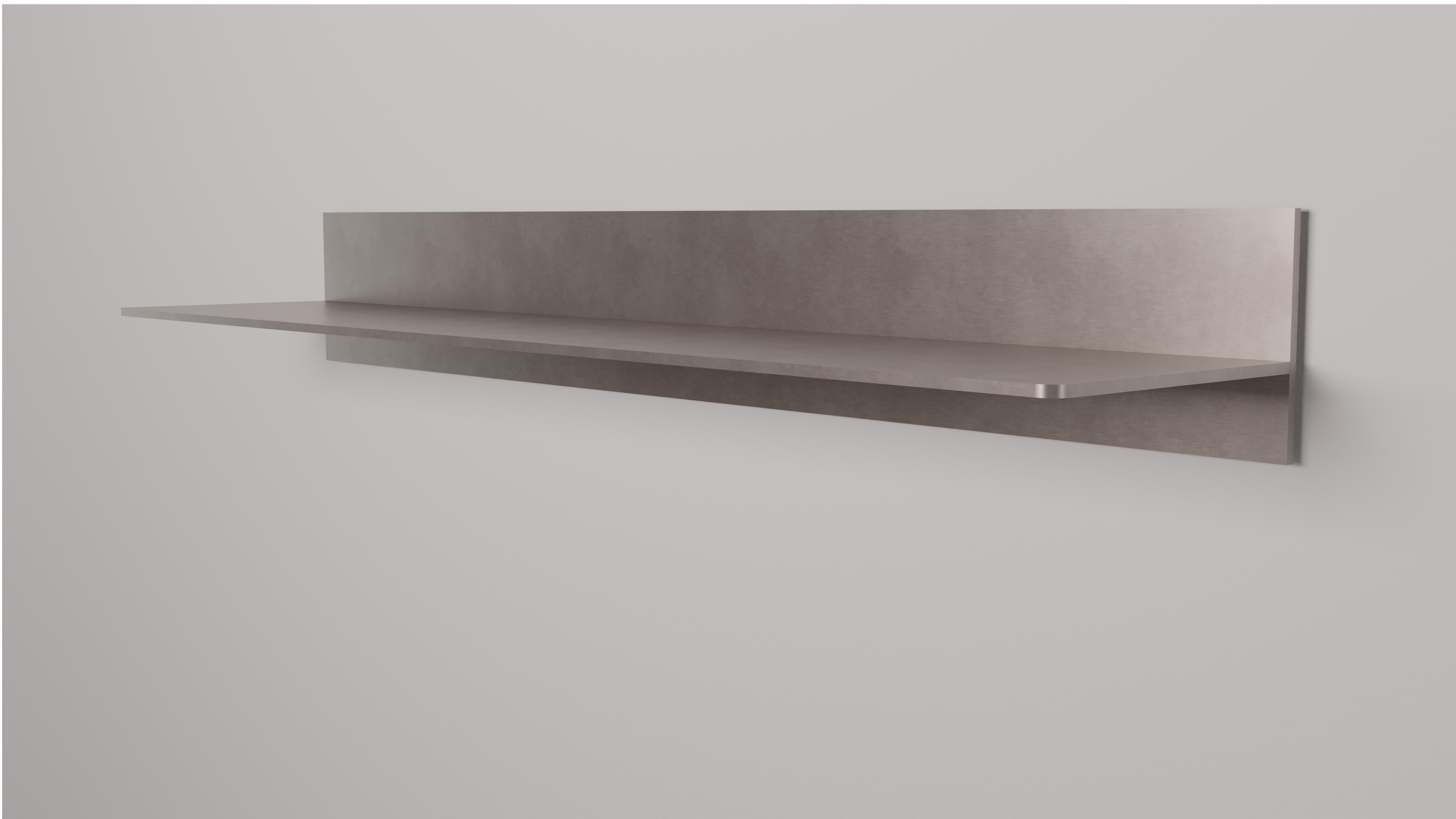 L-wall shelf in half inch thick aluminum plate. Digitally cut aluminum plates intersect and are fused with recessed welds that are ground smooth. Plates are hand finished and waxed. Included are custom, steel wall cleats with instructions for simple