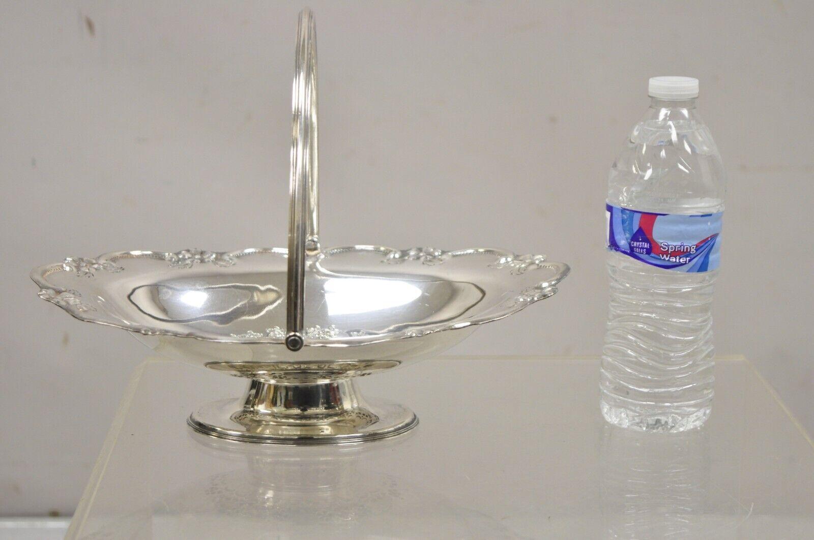 Antique L & WS English Victorian Silver Plated Footed Fruit Bread Basket with Handle. Circa Mid 20th Century.
Measurements:  3.5