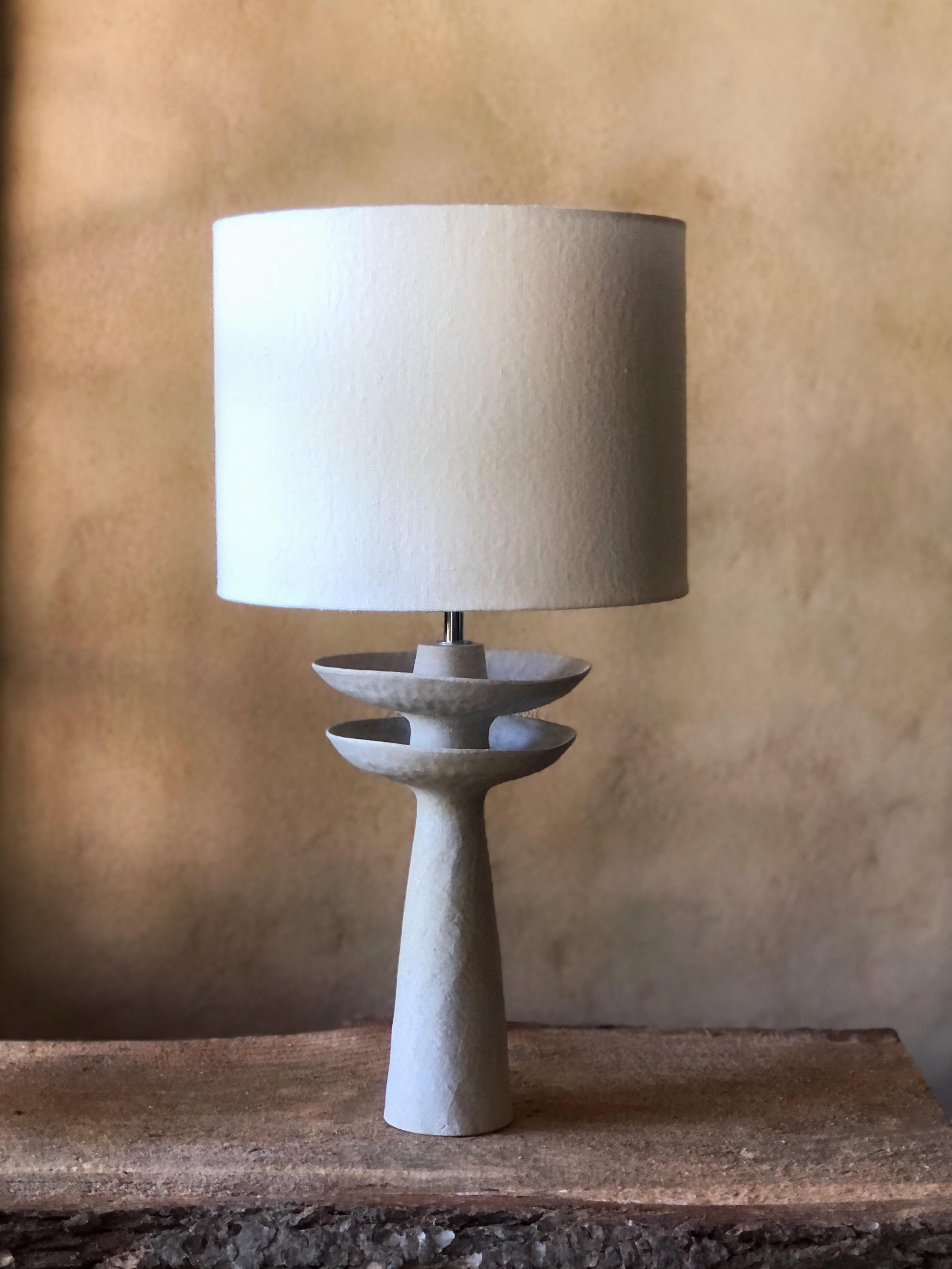 L03 Round Lamp by Sophie Vaidie
One Of A Kind.
Dimensions: Ø 28 x H 57 cm. 
Materials: Beige stoneware with porcelaine slip and white linen fabric.

All our lamps can be wired according to each country. If sold to the USA it will be wired for the