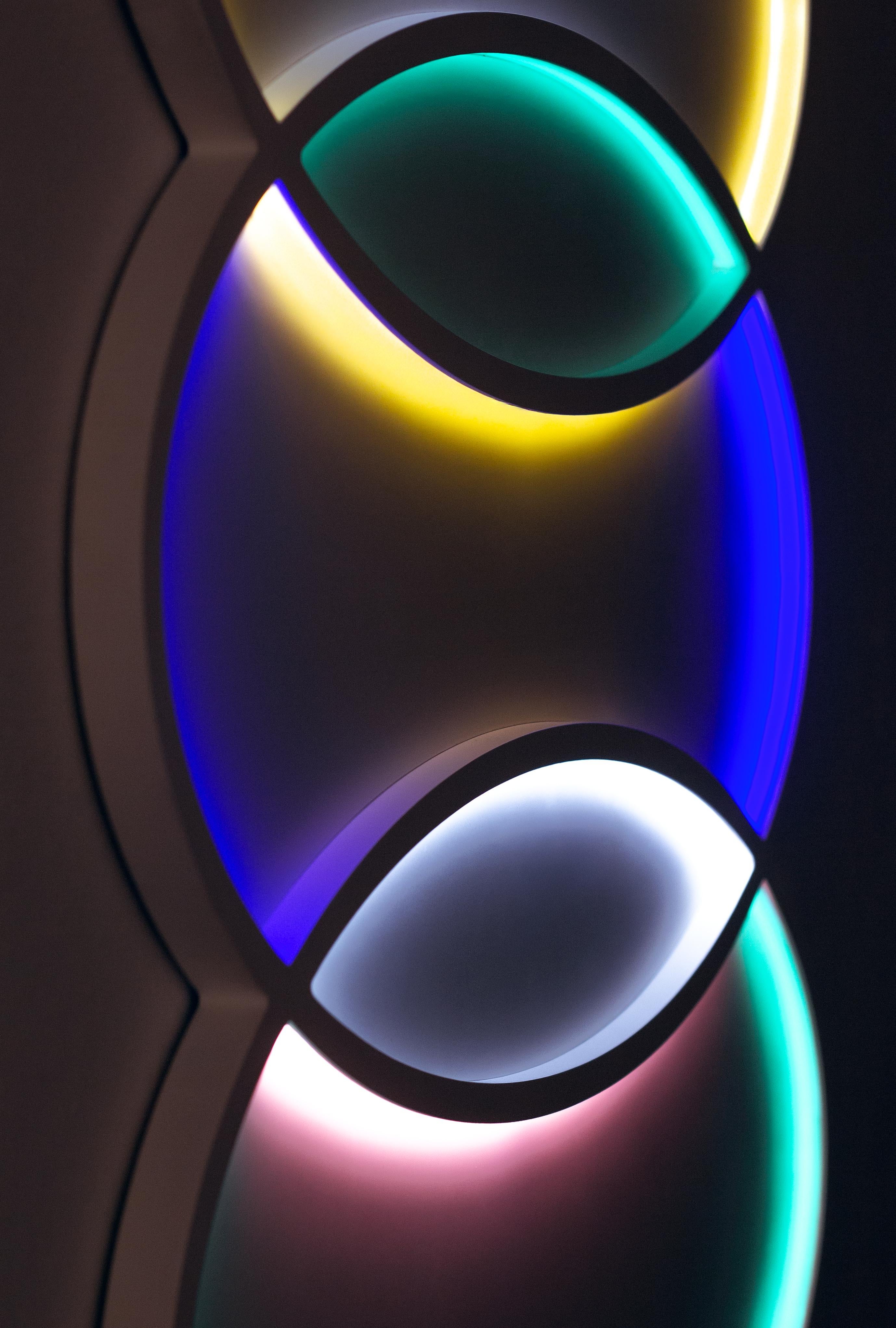 L5 by Paul Sende

35.4 × 51.2 × 1.2 in

Edition of 8 + 2 Artist’s Proofs

Wood, Acrylic, Aluminum, Paint, Lacquer, LED

Light sculpture composed of seven distinct sections, each outlined with a colored perimeter that casts a soft, tinted glow. The