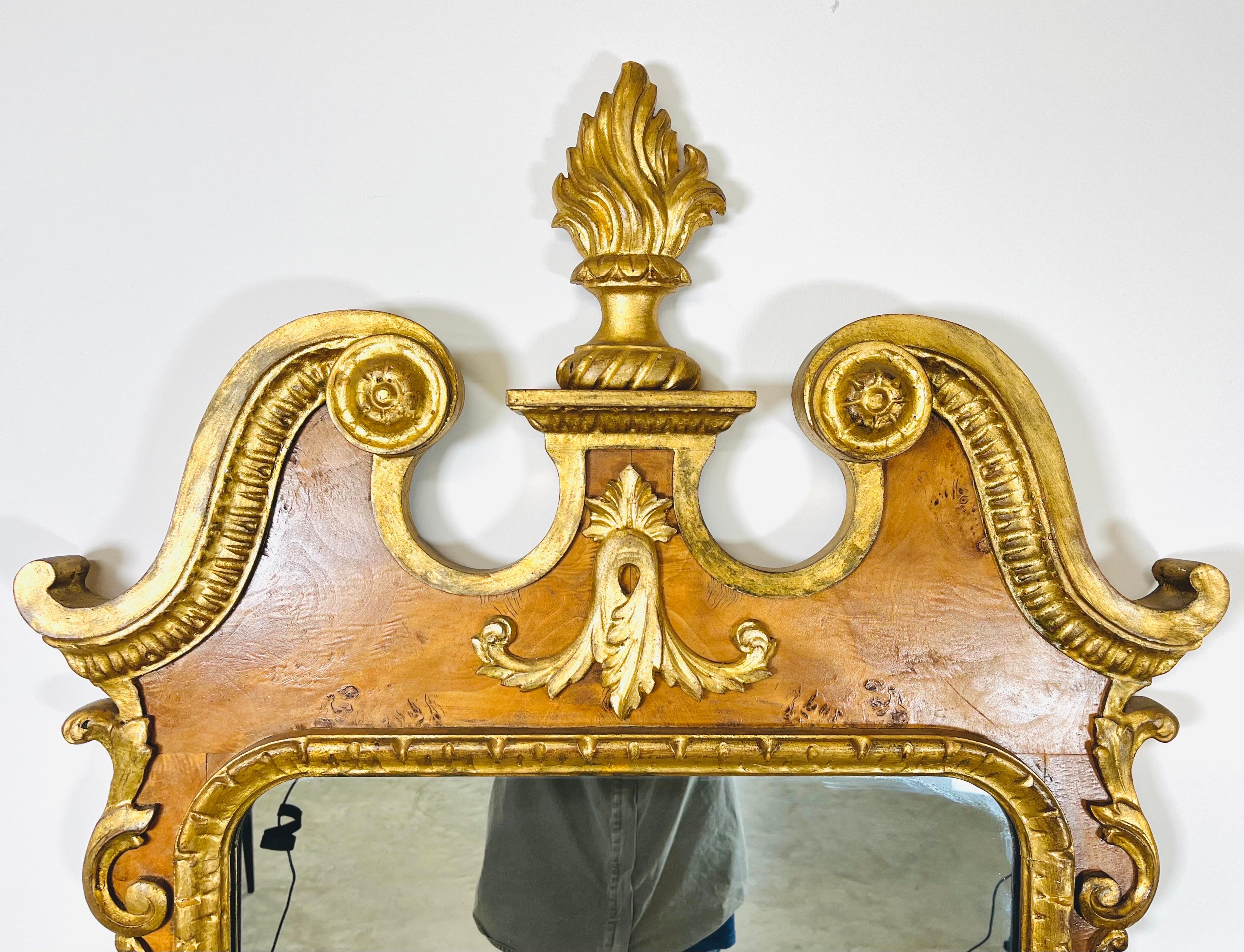 A beautiful Georgian style wall mirror having burl facing adorned with Gilt Gold hand carved accents. An absolute eye at her at 54x29x2” HWD. 
Signed La Barge on the back. Italy circa -1950.