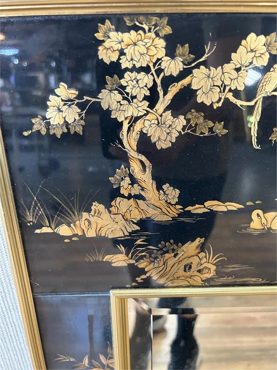 This fantastic mirror was made in the 1970s in the Chinoiserie style by LaBarge, a prestigious mirror manufacturer at the time. This model in particular is built to the point of overengineered. Made of an anodized aluminum serrated edge frame, the