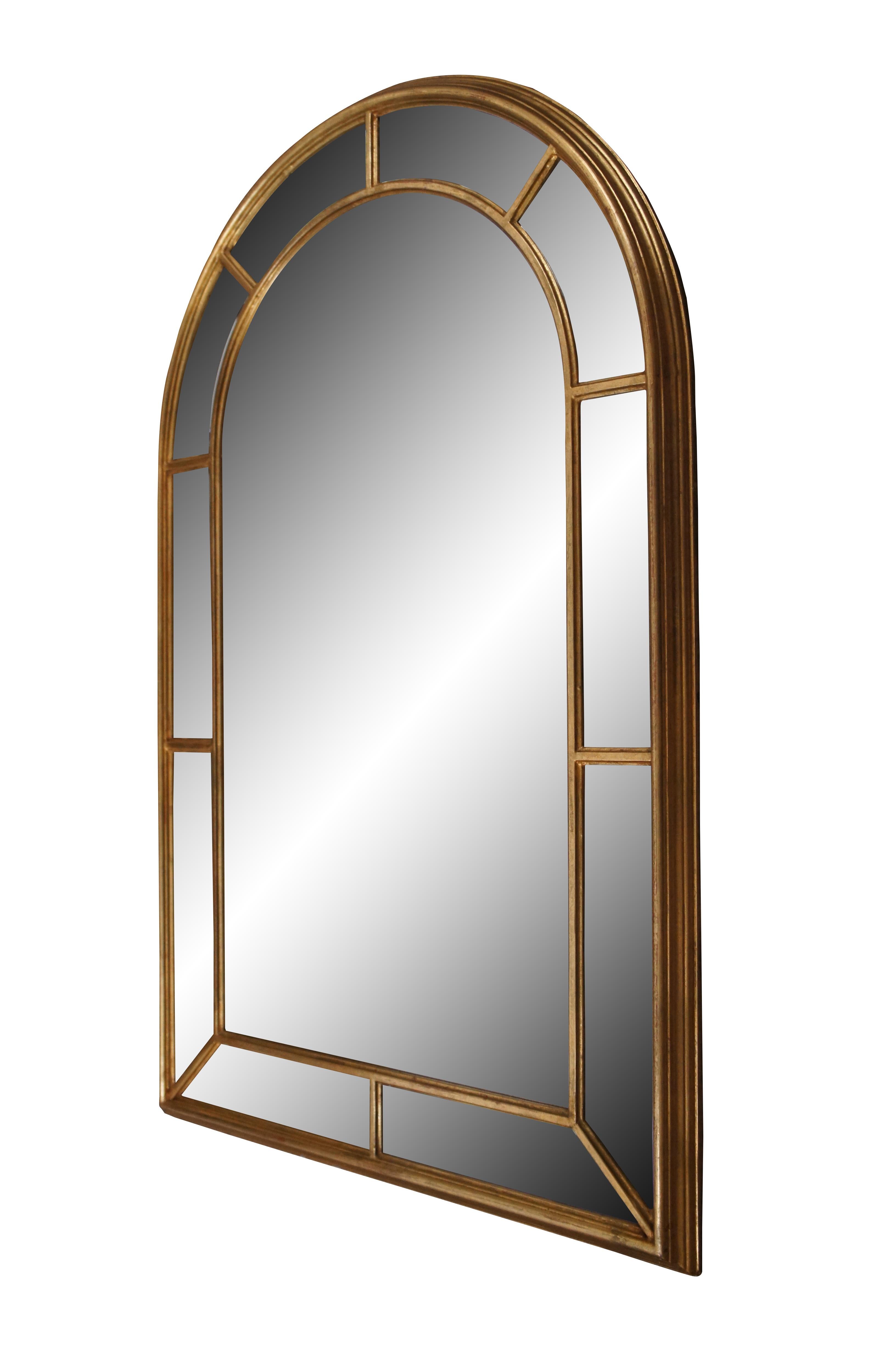 Vintage Italian Hollywood Regency gold arched palladian wall mirror featuring beveled panels surround a larger central mirror. Circa 1970’s. Sold by La Barge of Holland, Michigan. Crafted by SML Firenze. Item no. 1678-BG.  Made in