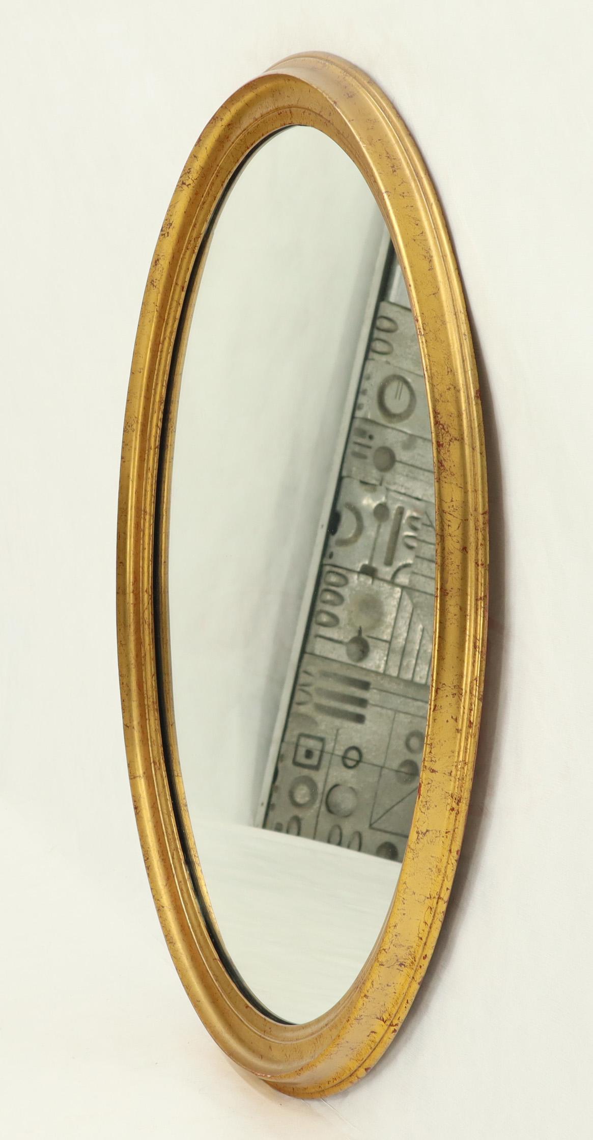 gold oval mirror