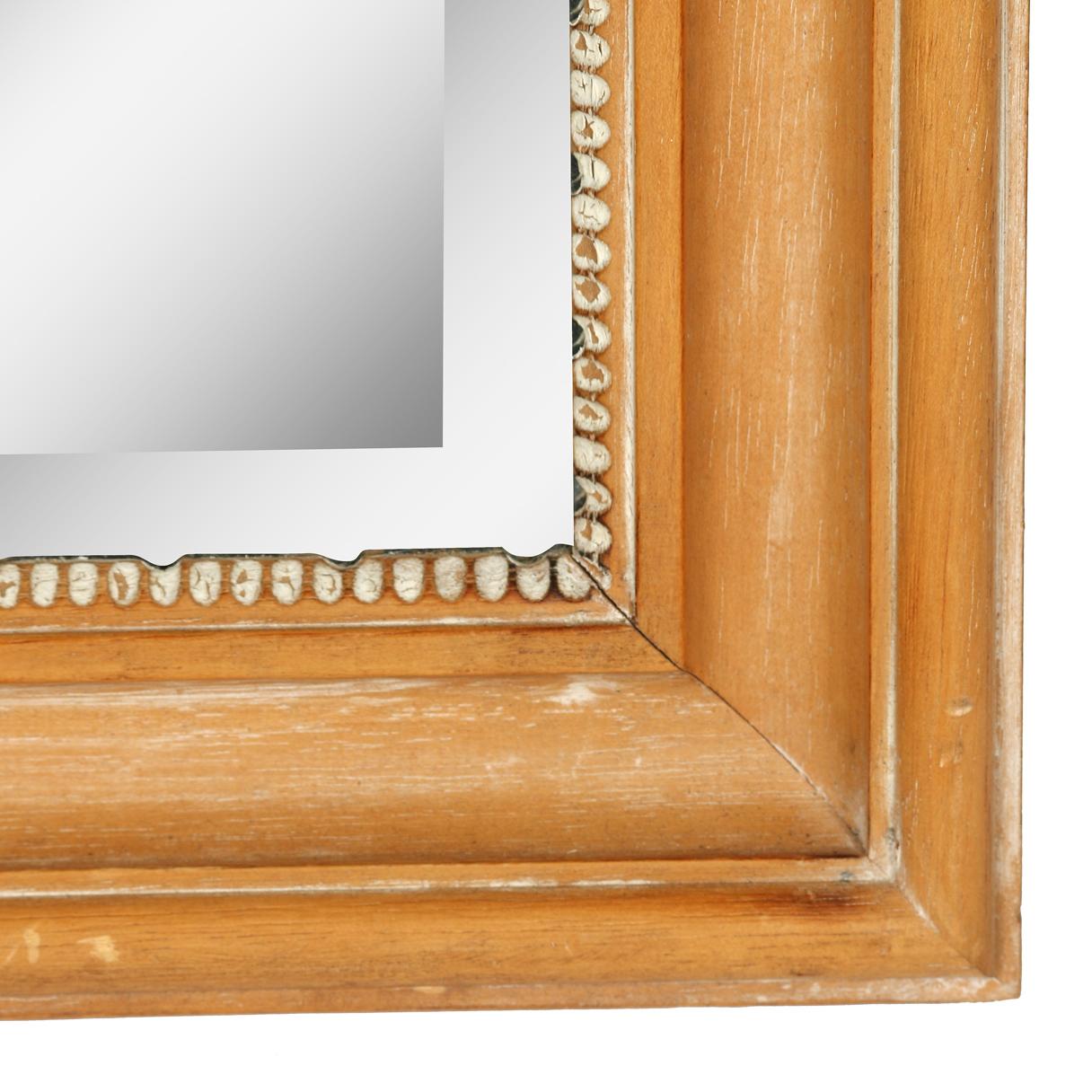 This large Rococo style mirror made by La Barge has great detail without being overpowering. The bleached fruitwood frame is adorned with a shell and scroll motif at top., and the beveled glass is surrounded by an inner beaded molding. This piece