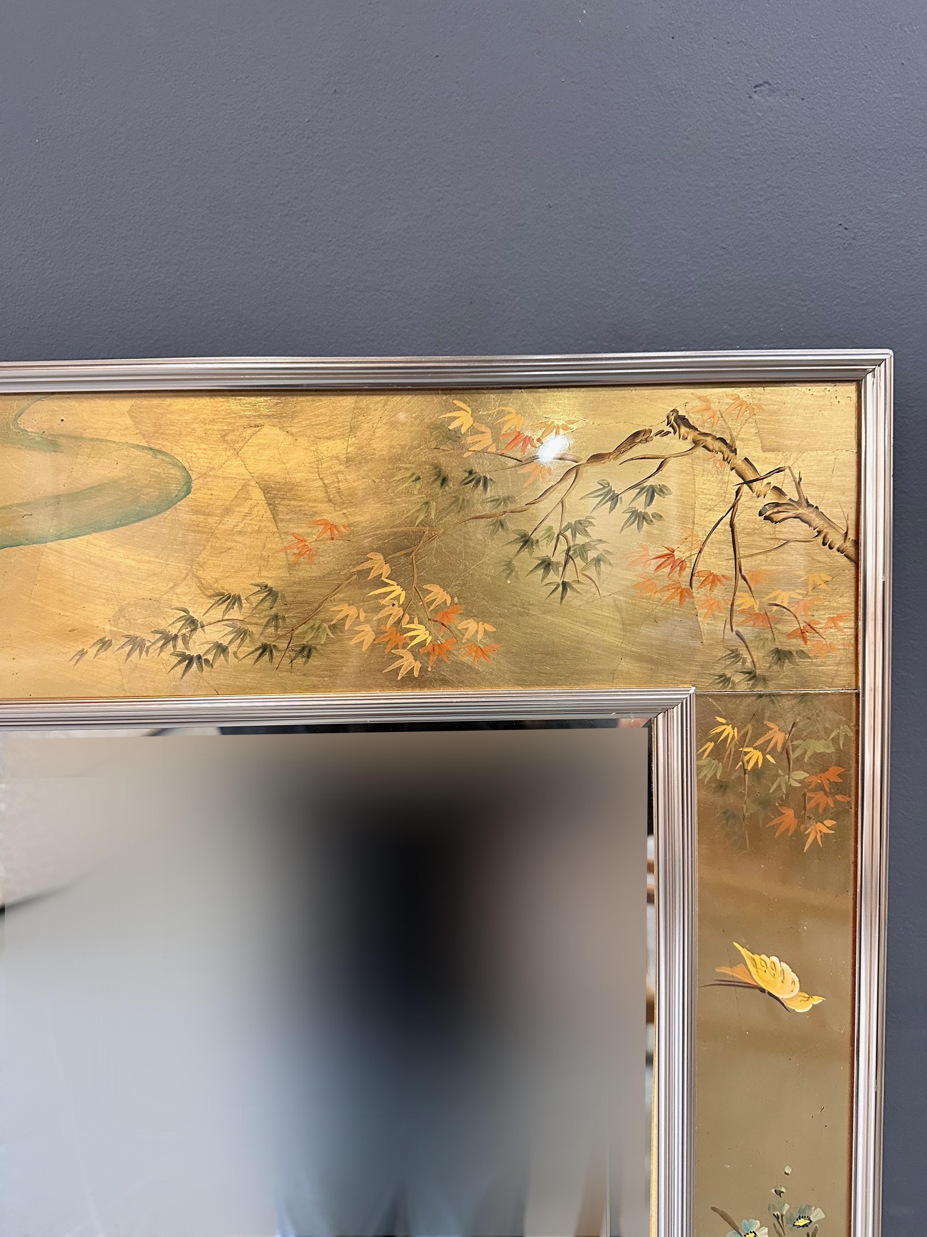 Lovely rectangular vertical mirror by Labarge having Chinoiserie decorated frame with gold gilt background poetically decorated with birds and Asian inspired foliage. Signed by the artist, see pictures