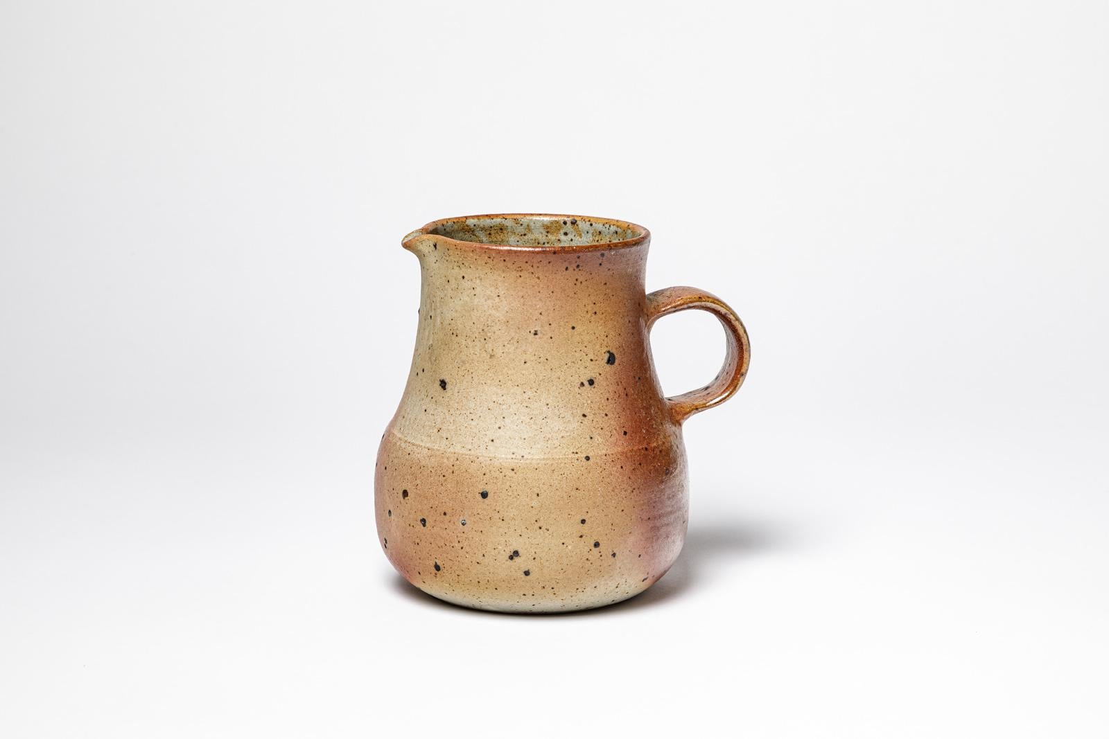 Montreau Lohof - La Borne

Large stoneware ceramic pitcher 

Realised circa 1960

Unique handmade brown and grey ceramic piece

Original perfect condition

Height 17 cm
Large 17 cm