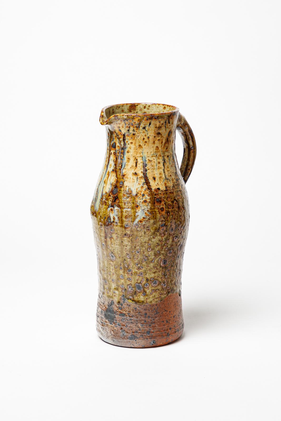 Robert Héraud 


Realised in La Borne 

Signed HERAUD 1947

Large brown and colored ceramic pitcher 

original perfect condition

Height 29 cm
Large 14 cm
