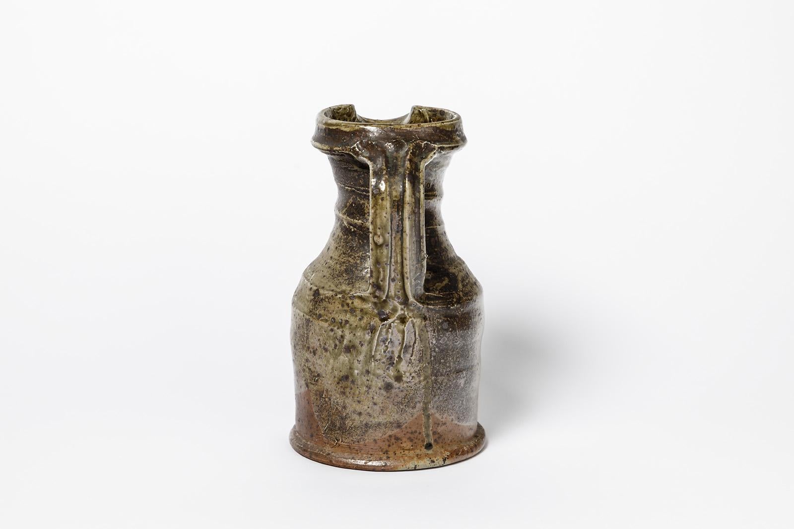 Pierre Digan (attributed to)

Elegant brown stoneware ceramic pitcher 

Circa 1970

Original perfect conditions

Measures: Height : 22cm, large : 15cm.
