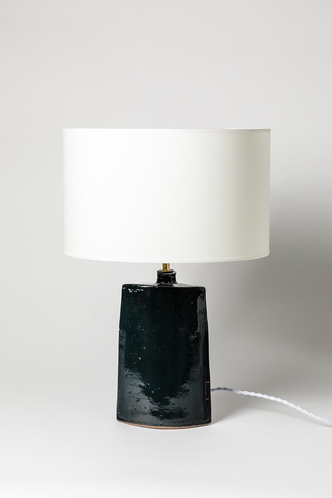 La Borne,

circa 1970

Elegant midcentury stoneware ceramic table lamp.

Black ceramic glaze color.

Original perfect condition.

Signed at the base.

Sold without lampshade, electric system is new.

Ceramic dimensions: Height 27cm,