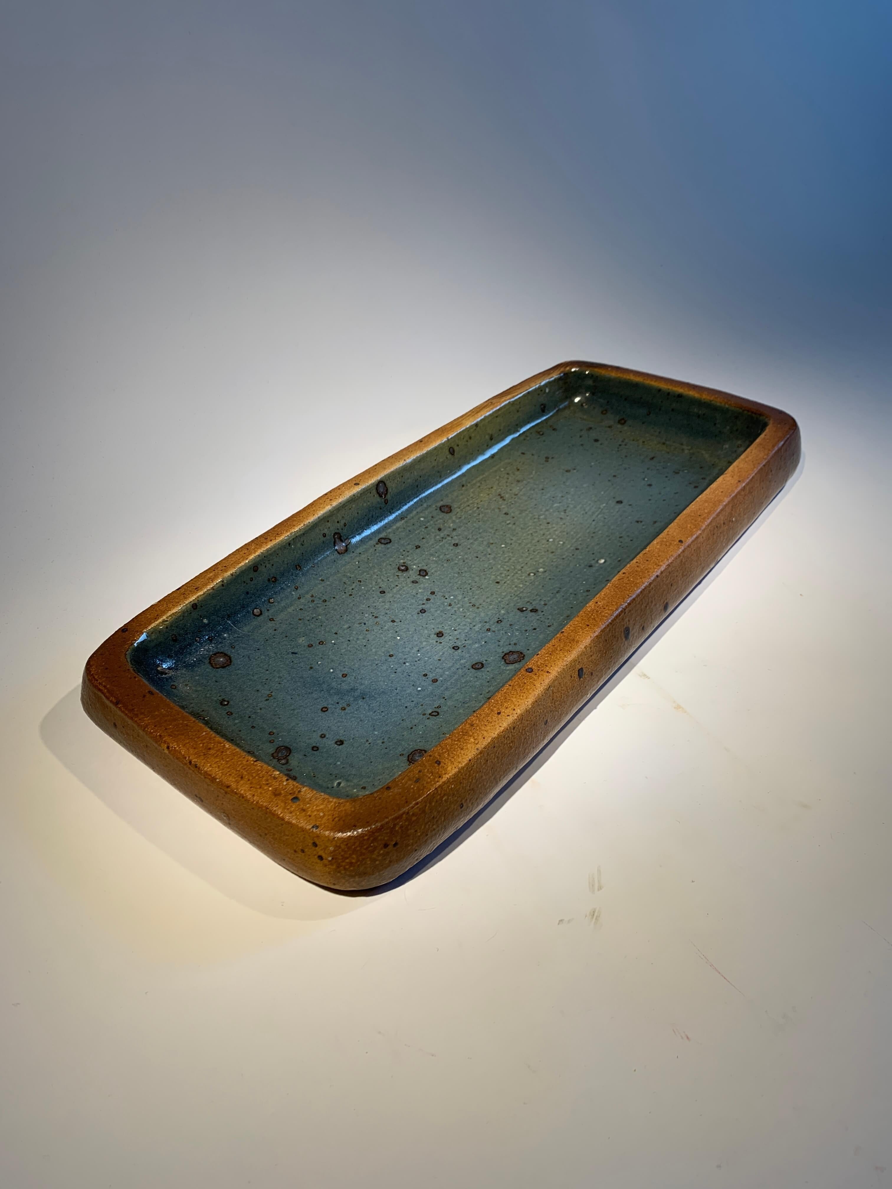 Pierre Digan (1941-2016), artist from La Borne in France, was renowned for his sandstone creations. 
Its generous pyrite stoneware bowl, glazed with a magnificent blue inside, is a fine example.
Unique piece in perfect condition.

Dimensions:
L52cm