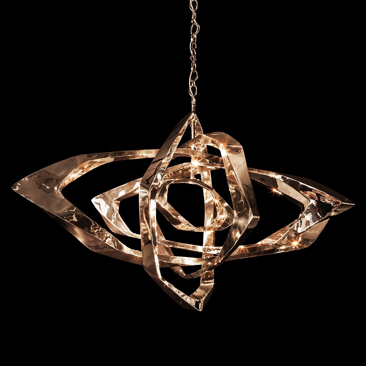 Designed by Barlas Baylar, the La Cage Chandelier has a unique contemporary style that makes a statement in any environment.  The La Cage is created by LED bulbs embedded into the Bronze frame.  The resulting light creates dynamic visual effects