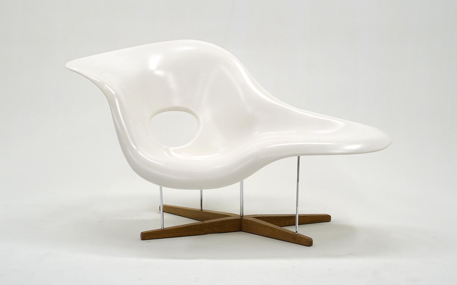 Early first generation Eames La Chaise.  The first generation chairs were constructed with a double layer of fiberglass making the piece quite substantial, durable and heavy weight.  Later models use a single layer.  This example is in amazingly