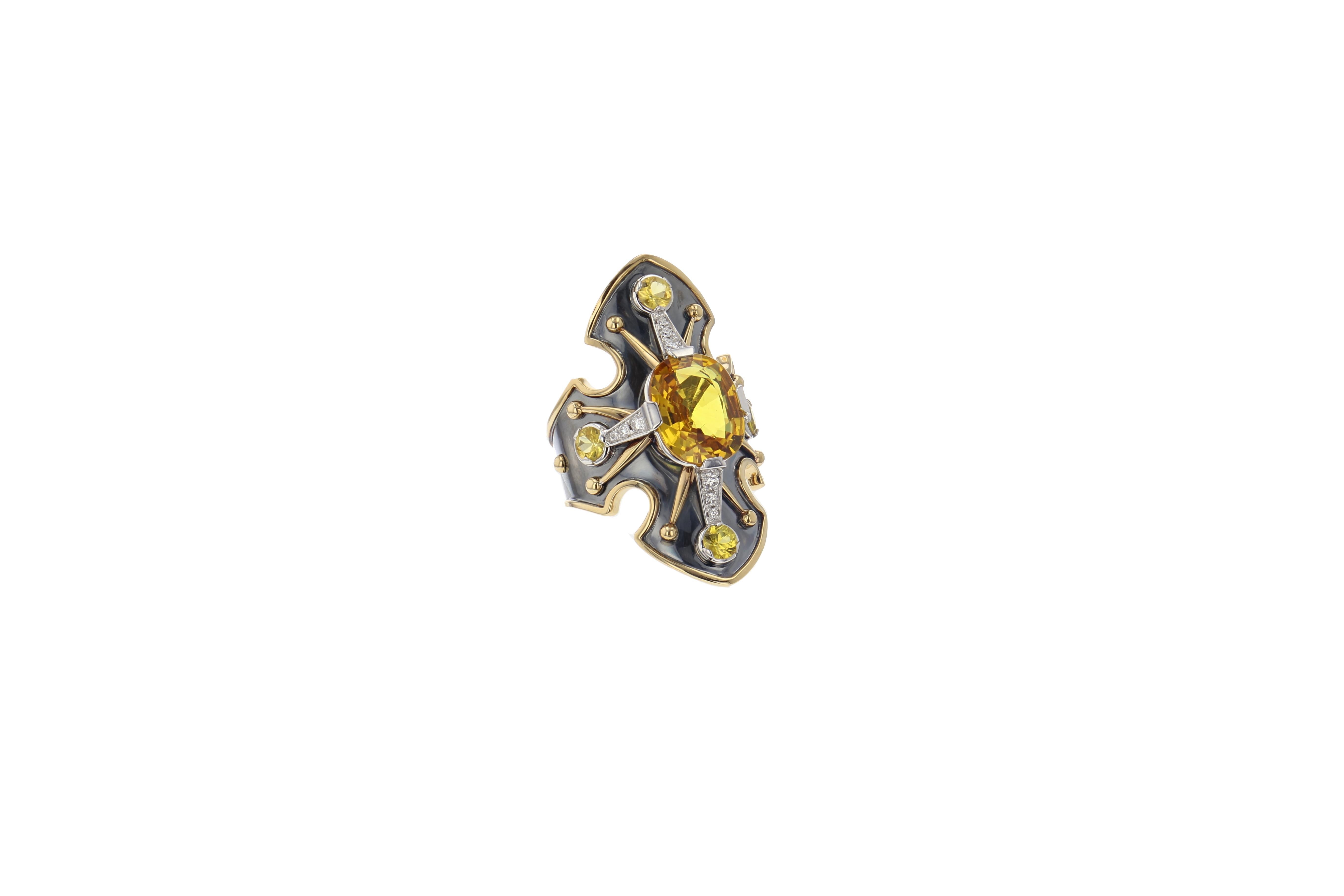 18K Yellow Gold and Distressed Silver Statement Shield Ring.
Encrusted with Diamonds (0.23 cts) and 5 yellow sapphires including a central one of 4.5 cts