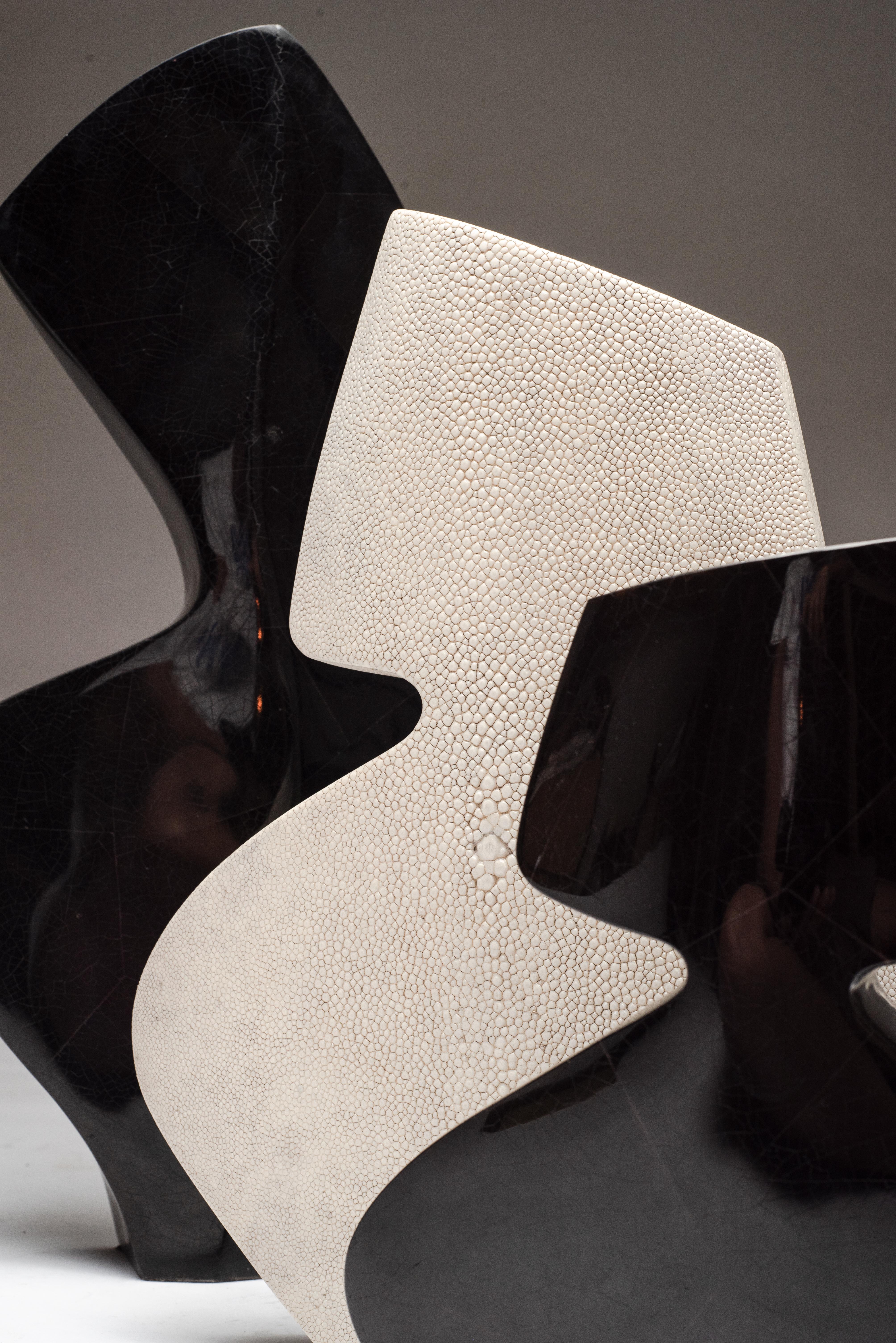 La Dame & La Femme vases by R&Y Augousti are beautiful sculptural pieces that are both feminine & bold, inlaid completely in black pen shell, cream shagreen and black pen shell respectively to create a dramatic statement. Available to be purchased
