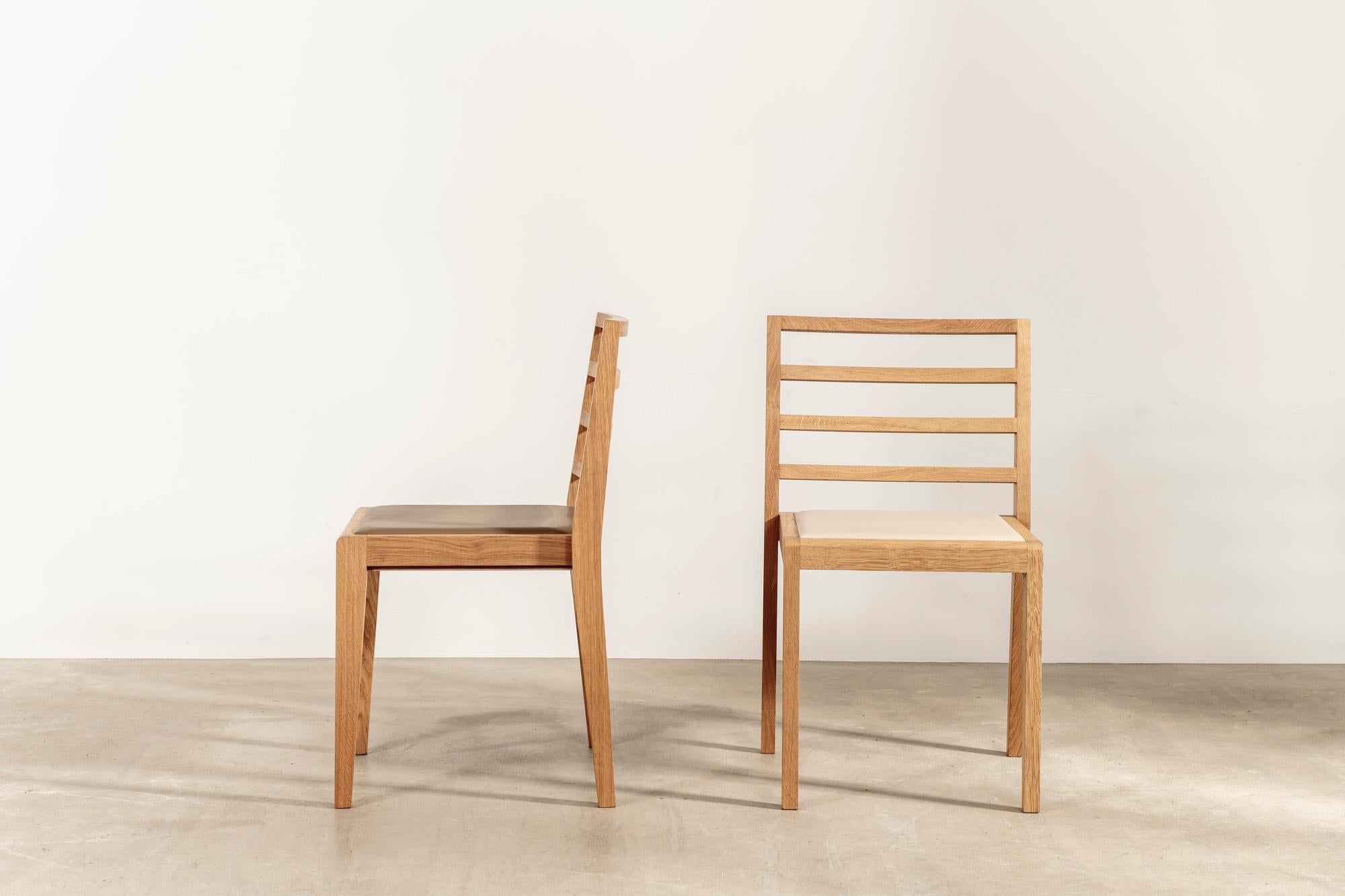 La discrète is a cabinetmakers chair; understated at first glance, but revealing a sophisticated craftsmanship upon closer inspection.

Light and stackable, the chairs have been manufactured from European oak to traditional standards by English