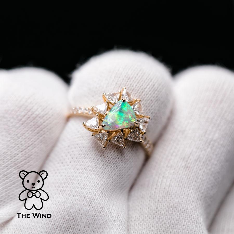 La Estrella - 0.916 ct Halo Trillion Diamond Australian Black Opal Engagement Wedding Ring 18K Yellow Gold.

Design name: La Estrella!
A star glows in the dark night!

Design idea: The opal is surrounded by 0.744 ct of trillion diamonds to present