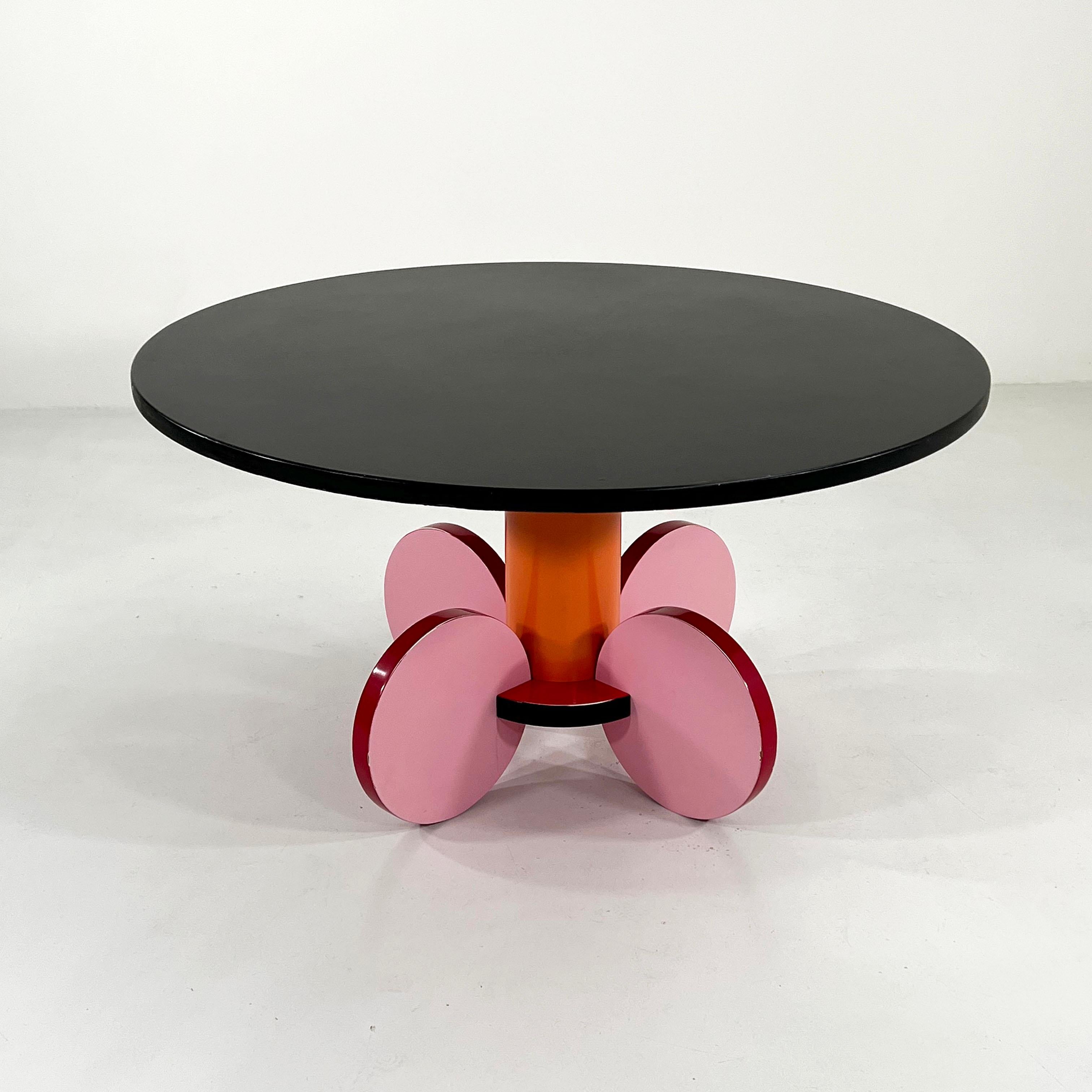 Designer - Michele De Lucchi
Model - La Festa Dining Table
Design Period - Eighties
Measurements - Width 130 cm x Depth 130 cm x Height 73 cm
Materials - Laminated Wood
Color - Back, Orange, Pink, Burgundy
Light wear consistent with age and use.