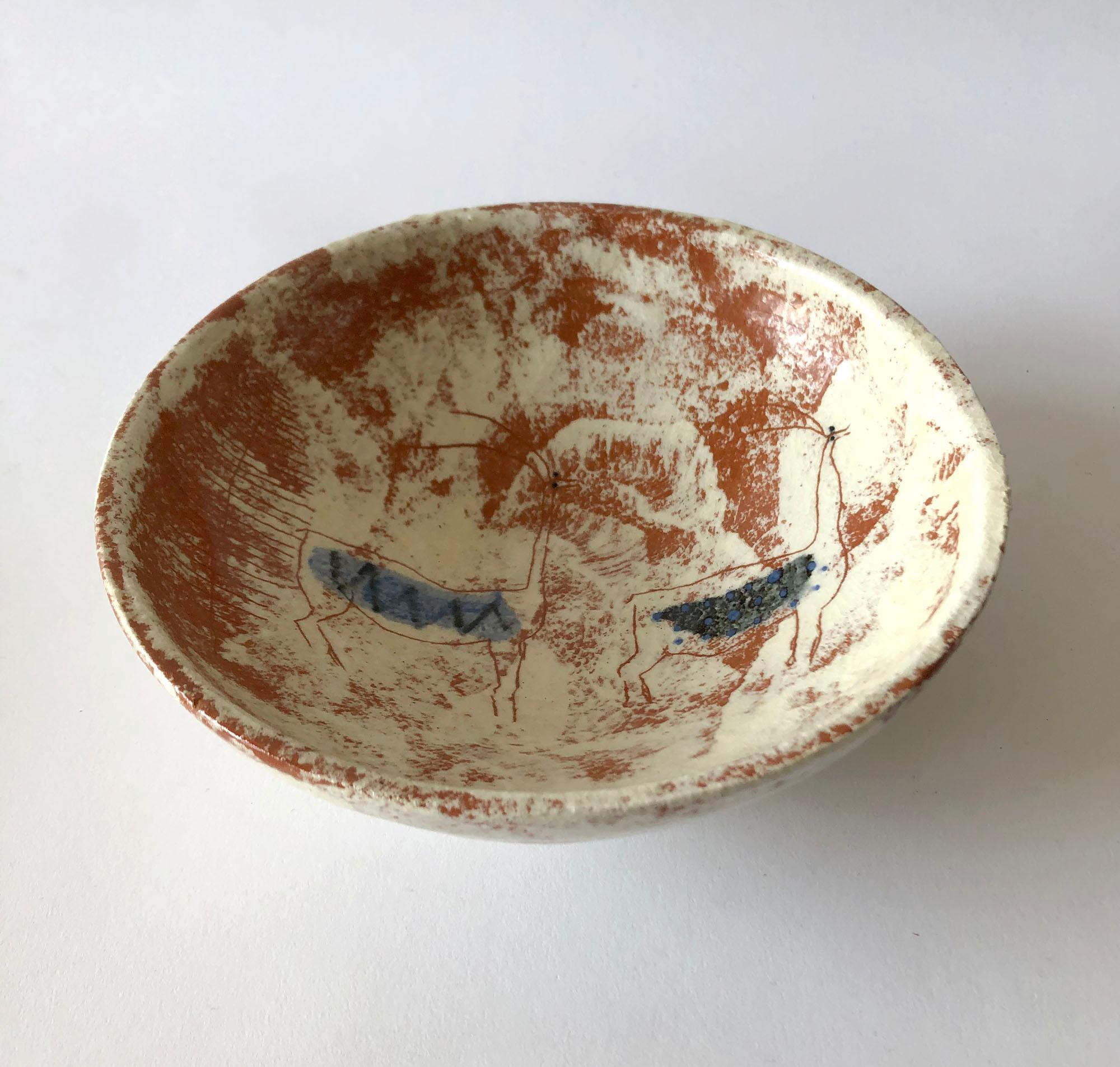 Studio ceramic bowl with carved, cave-like design created by La Gardo Tackett. Bowl measures 2.5