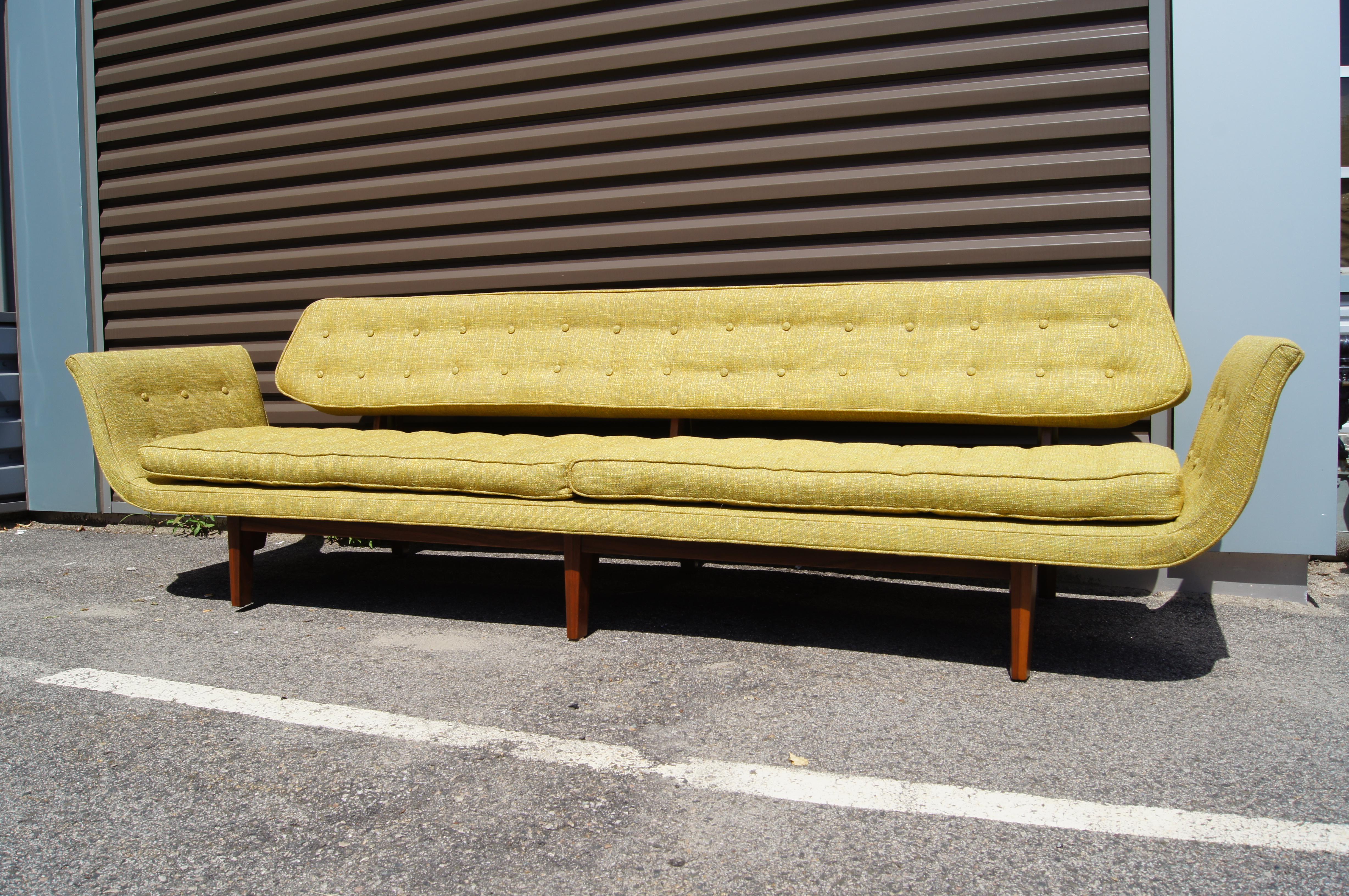 Designed as part of Dunbar's Janus Collection in 1957, La Gondola, model 5719, is one of Edward Wormley's most coveted sofas. This is the longer version with six legs. The solid walnut frame, upholstered in Knoll's Diva textile (in Green Tea),