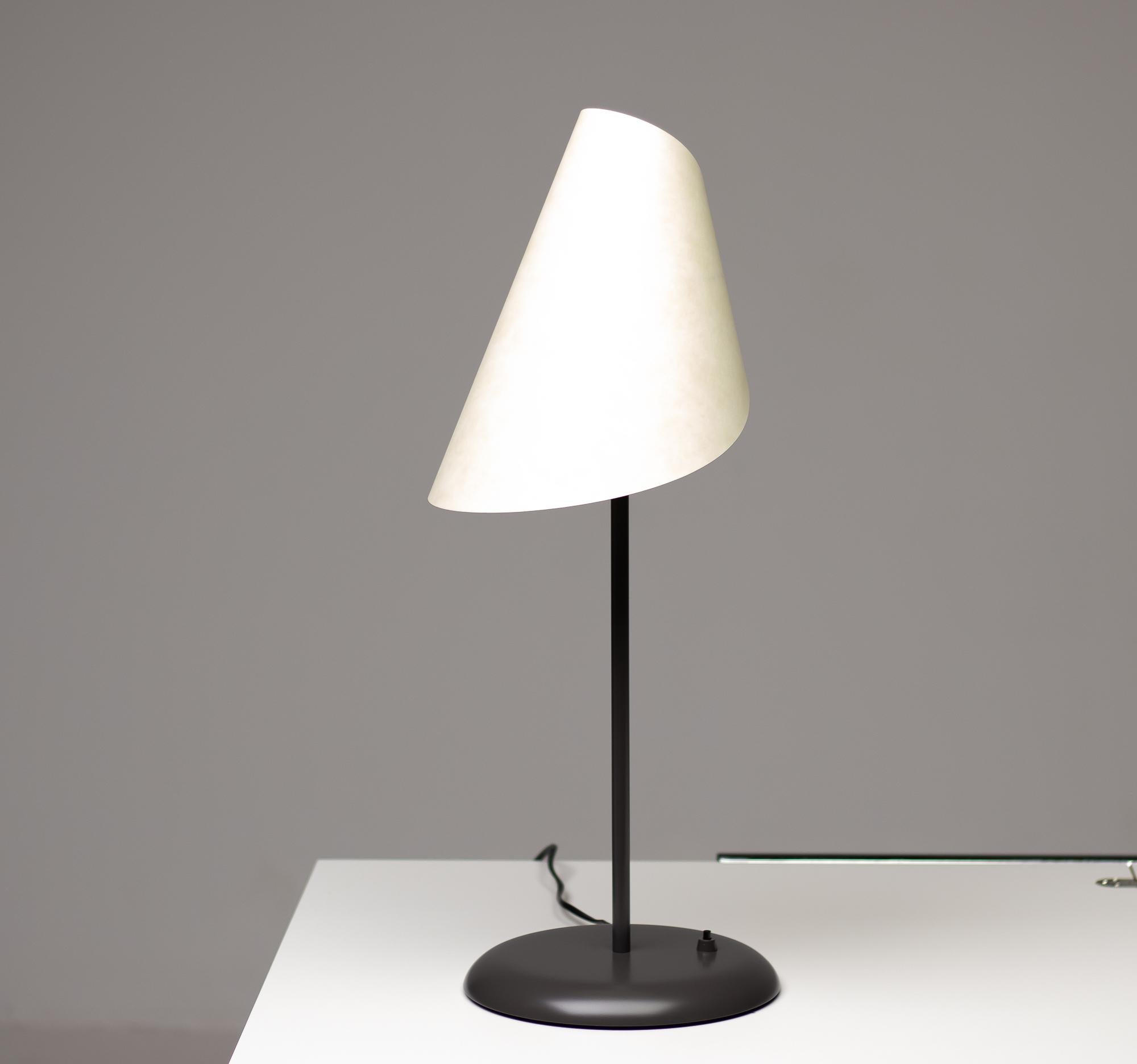 Elegant and rare table lamp made by Nemo Cassina.
Steel frame in grey, lampshade in white composite material.
Italy, 1973.
Marked with label.
4 available, priced individually.

References: 
Domus n. 754-755, 1993, p. 133; Domus n. 671, April