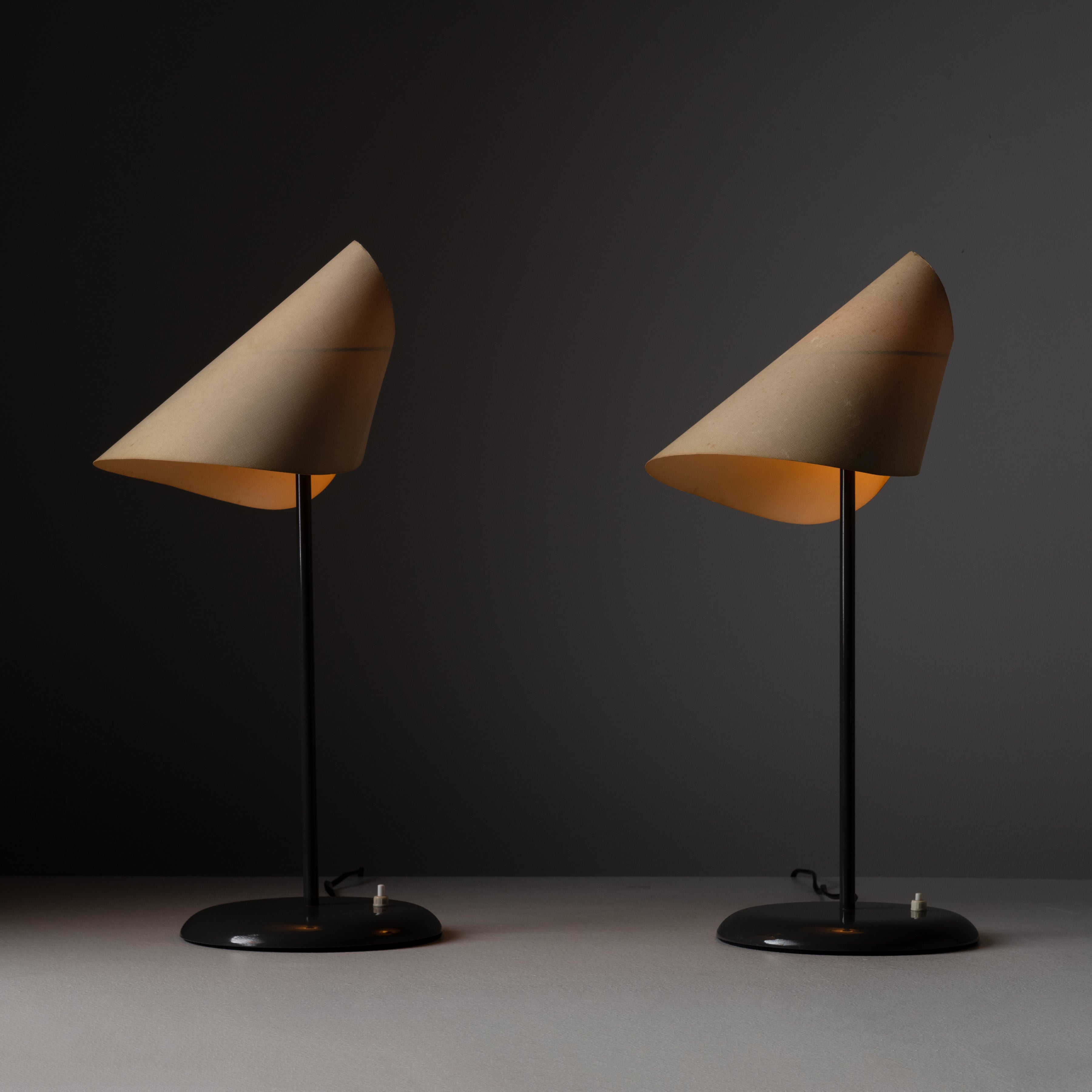 La Lune Sous Le Chapeau table lamps by Man Ray for Sirrah. Designed and manufactured in Italy, in 1973. Minimal and elegant table lamp composed of lacquered grey steel, with a conic paper shade. Each lamp holds an E14 bulb socket. We recommend using
