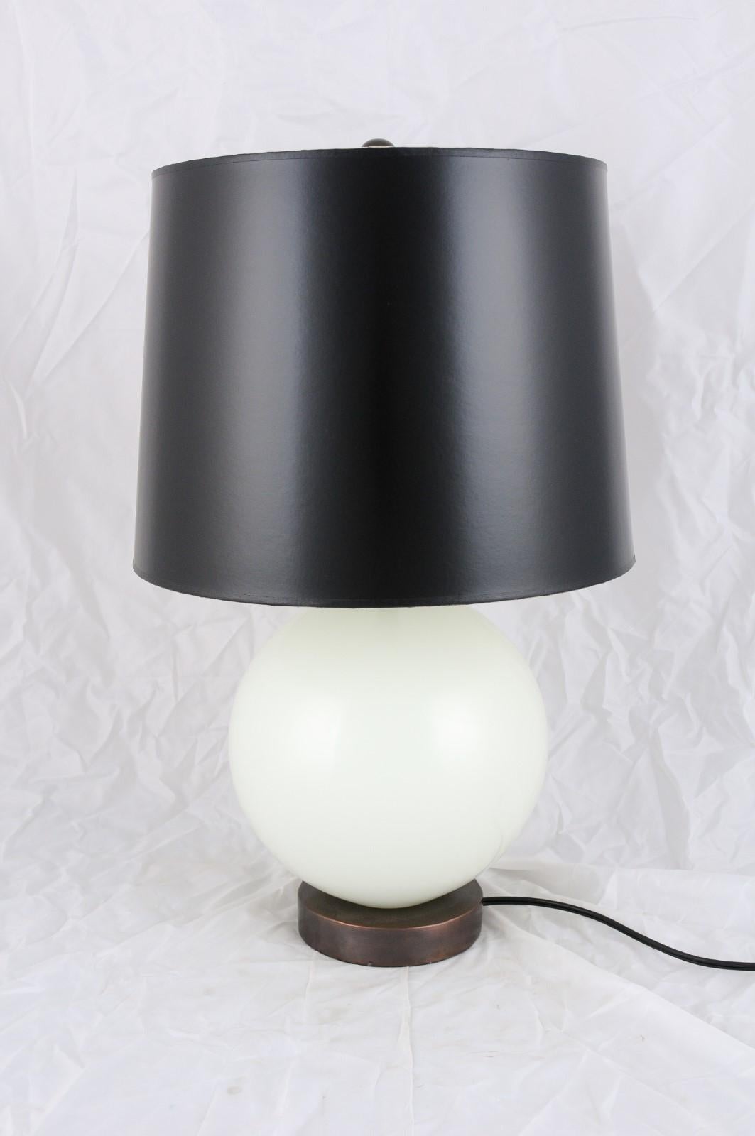 La Lune table lamp in Bai Jade Peking glass with a black copper base and black shade by Robert Kuo.