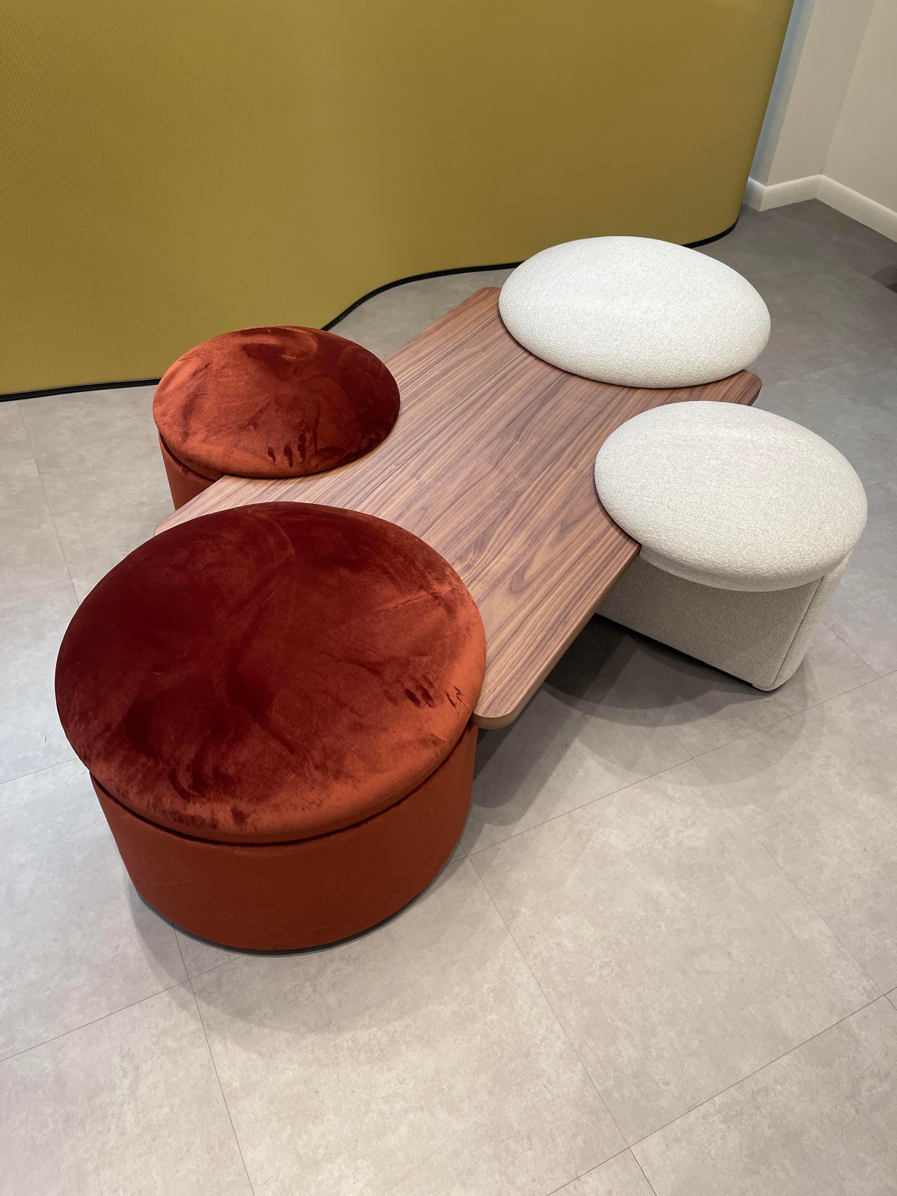 Variant 1 — Composed by 4 pouf and a top in walnut wood.
Pouf can be sold individually. 
Table can be with 2 poufs.
Different top options.
Different upholstery materials available. Price listed for starting fabric.

The Amazone collection is