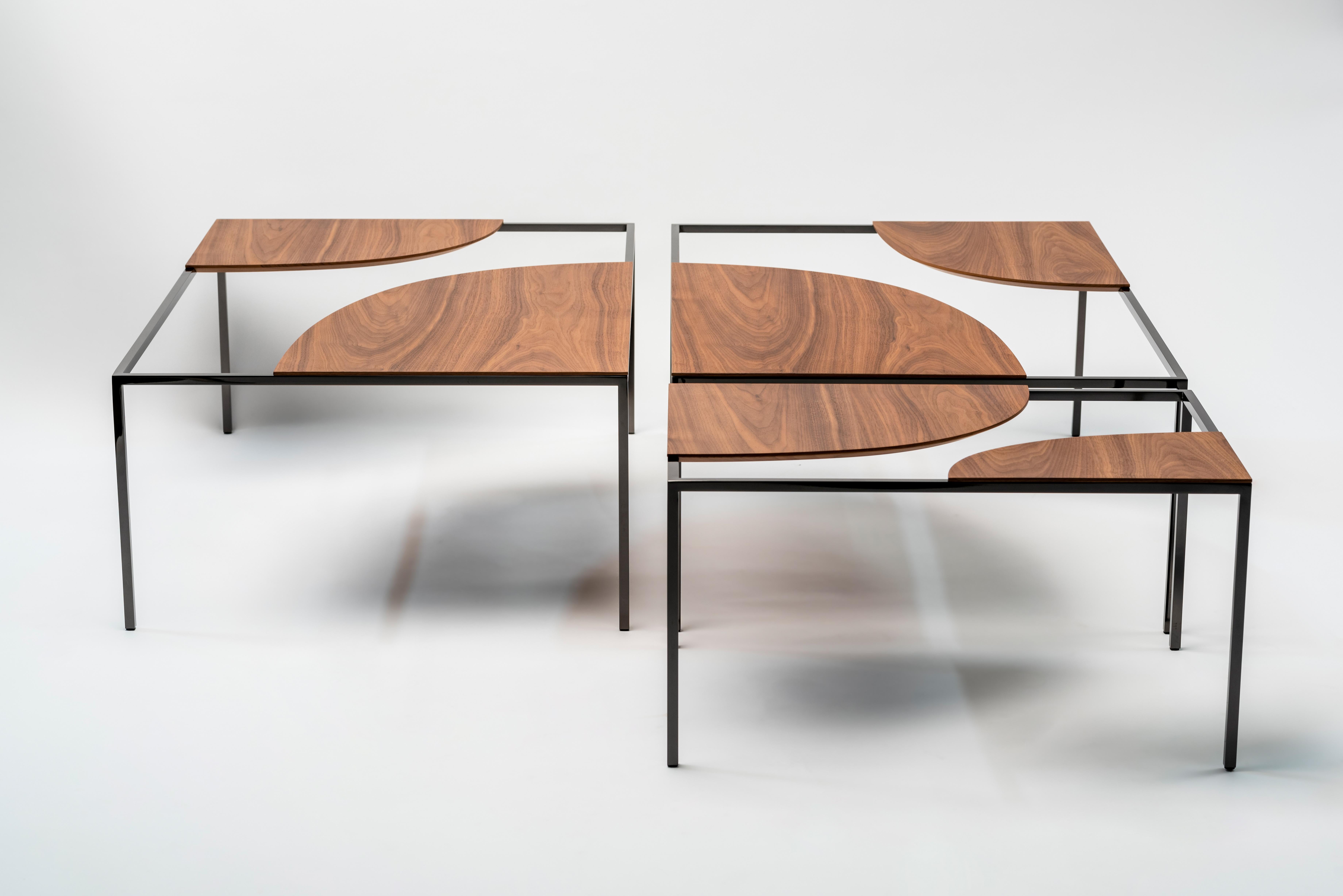 Creek is a table that suggests a stream of water flowing freely across its surface and around islands, circling around the table tops placed in opposite corners.
The tables come in five different sizes and shapes and when placed alongside one