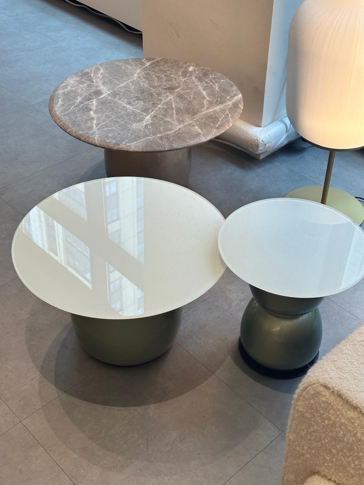 Gem Table in Marble

Top in Marble Emperador tundra Legs in
liquid painted Bronze Size : Dia.700xh385
mm

The Gem table boasts an interactive design. Its configuration is reminiscent of the stacked towers made of round pebbles on beaches. It is