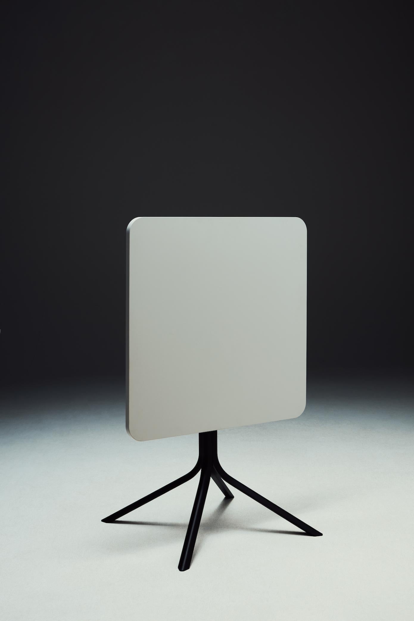 Fixed or folding.
Painted structure, top in lacquered mdf
High Tri is a contemporary, foldaway side table designed as a celebration of industrial craftsmanship. The thin extruded aluminium legs are ideally positioned to allow users to combine