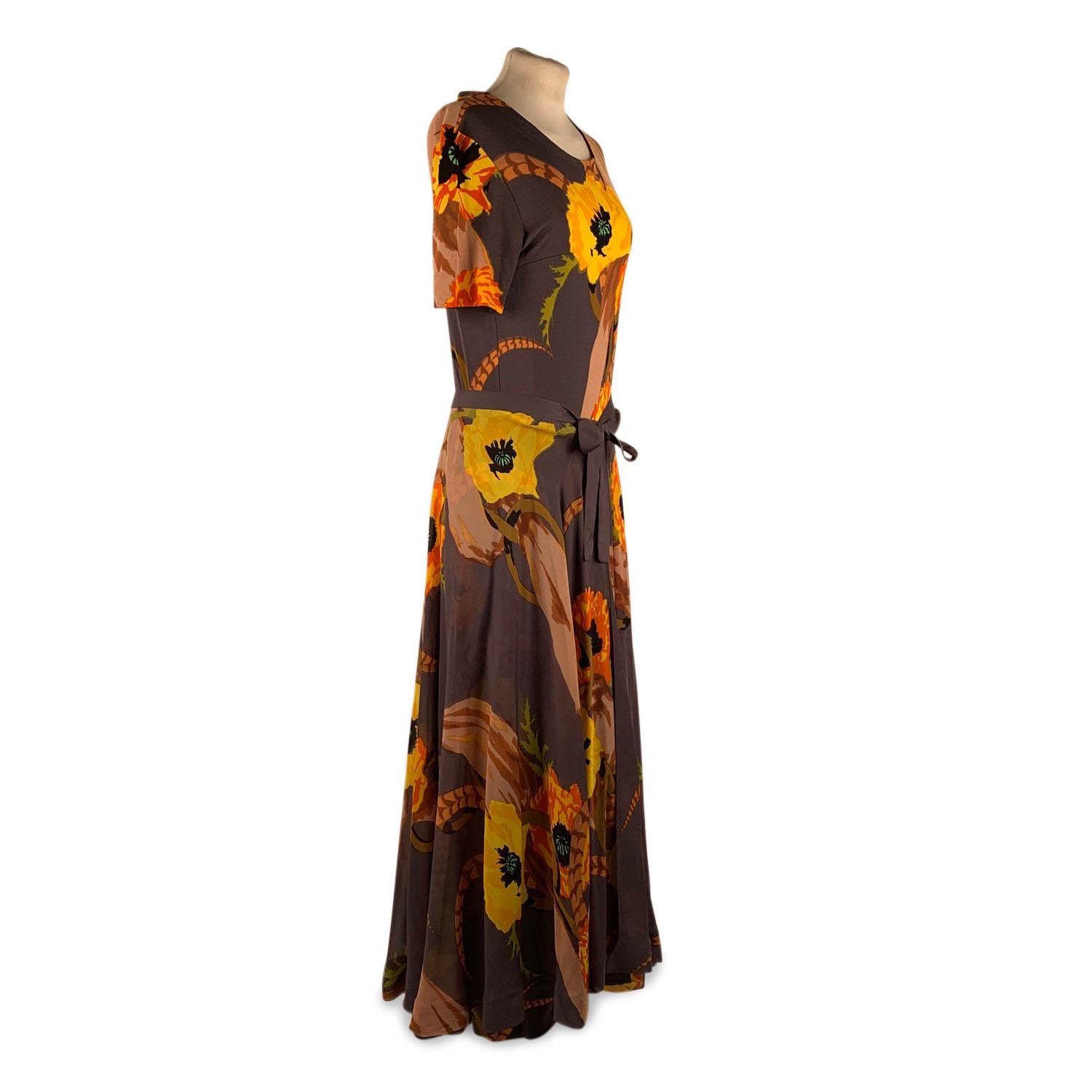 La Mendola Vintage Floral Silk Jersey Maxi Evening Dress

Vintage 1970 jersey and silk set of 3 pieces in a floral pattern from La Mendola, Italy consisting of a maxi dress, a belt and a matching semi sheer silk over skirt. Beautiful Gray,