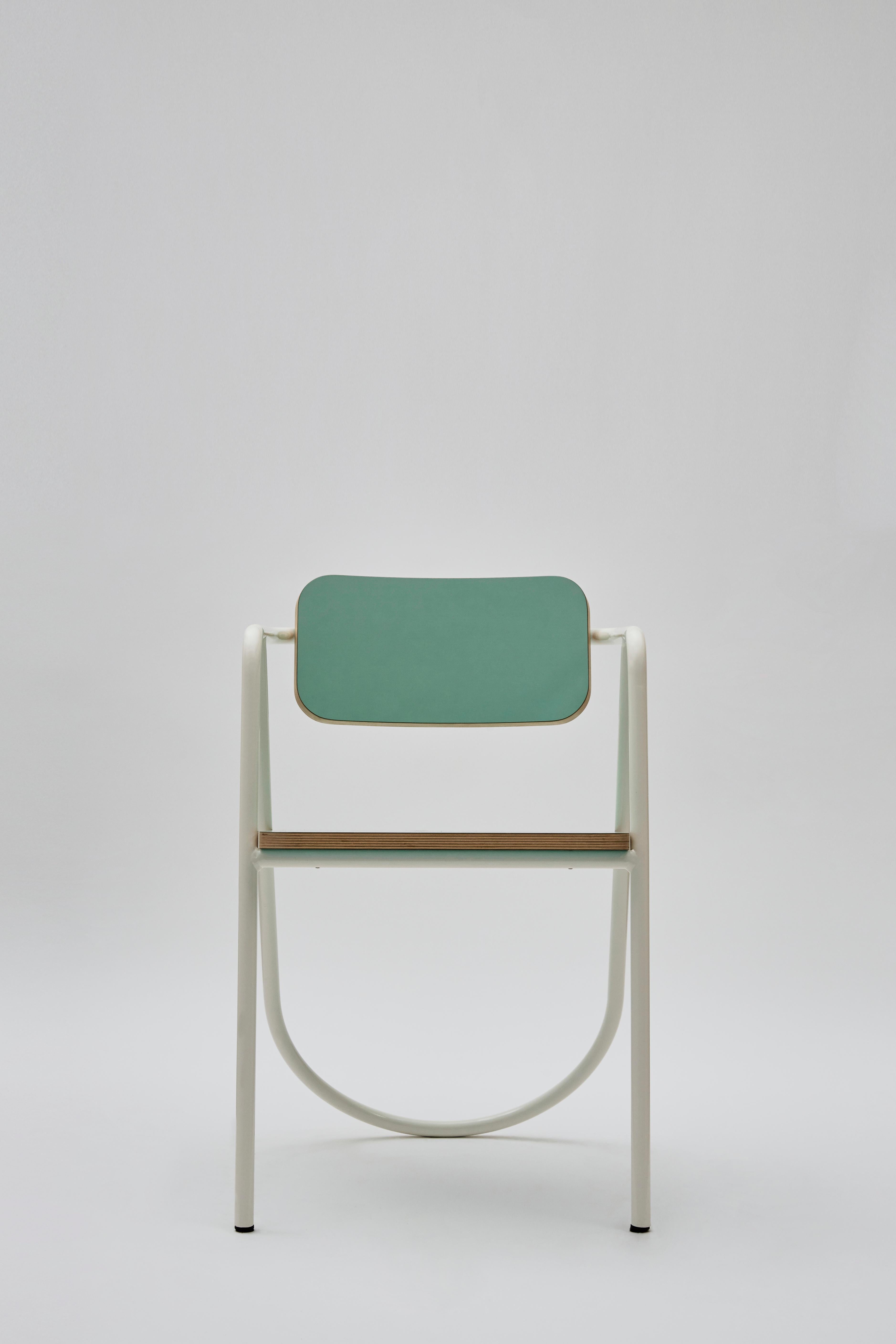 This elegant chair part of the La Misciù Collection boasts a graceful cylindrical steel structure finished in white, coupled to a seat and backrest marked by rounded corners and finished in bright teal. Available in multiple color options to be