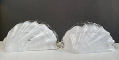La Murrina 1990s pair of shell-shaped wall lamps in Murano glass and gilt metal.