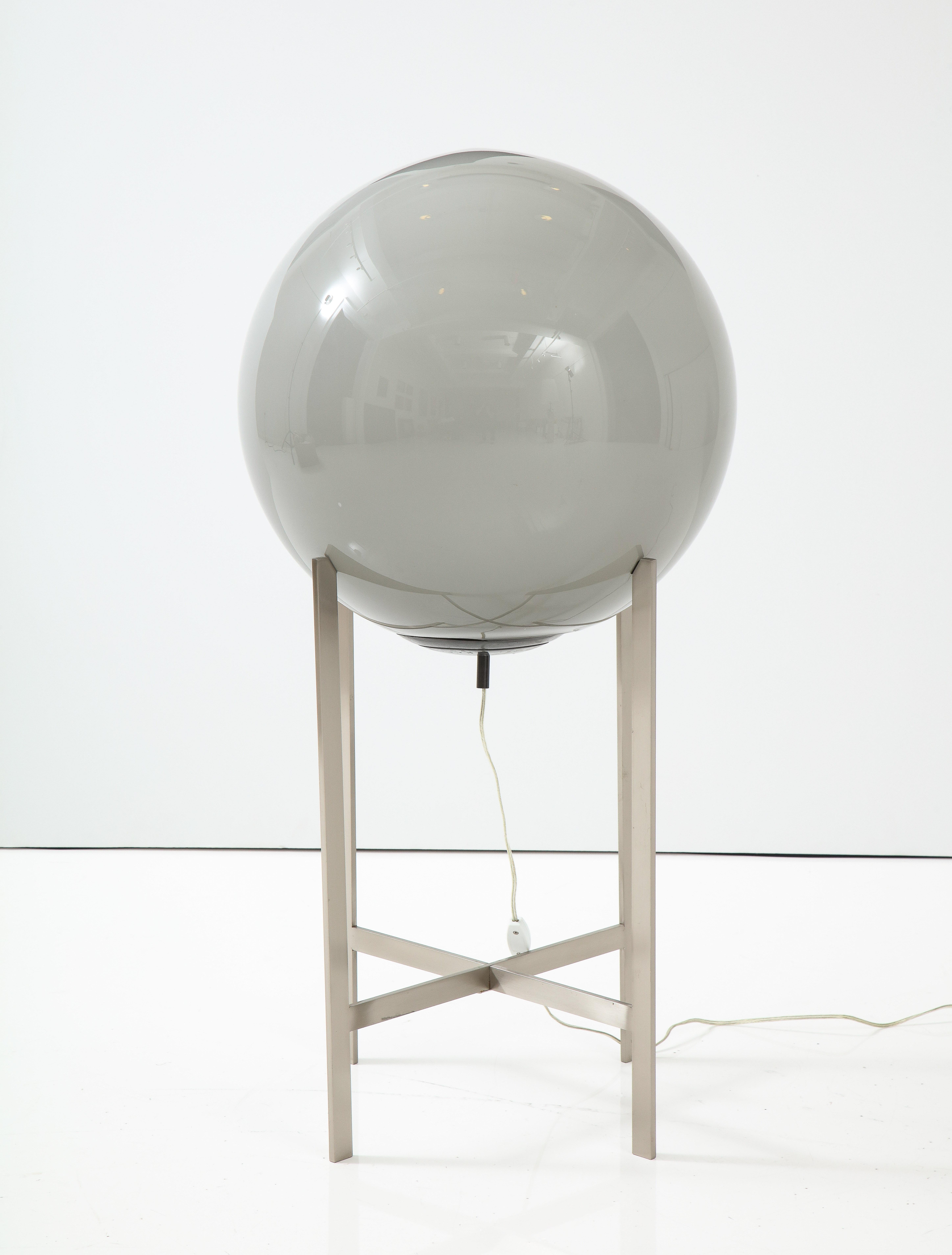 Italian mid century floorlamp featuring a brushed steel stand and an oversized grey Murano orb. C70/80s Italy. Uses 1 bulb. Base is 15