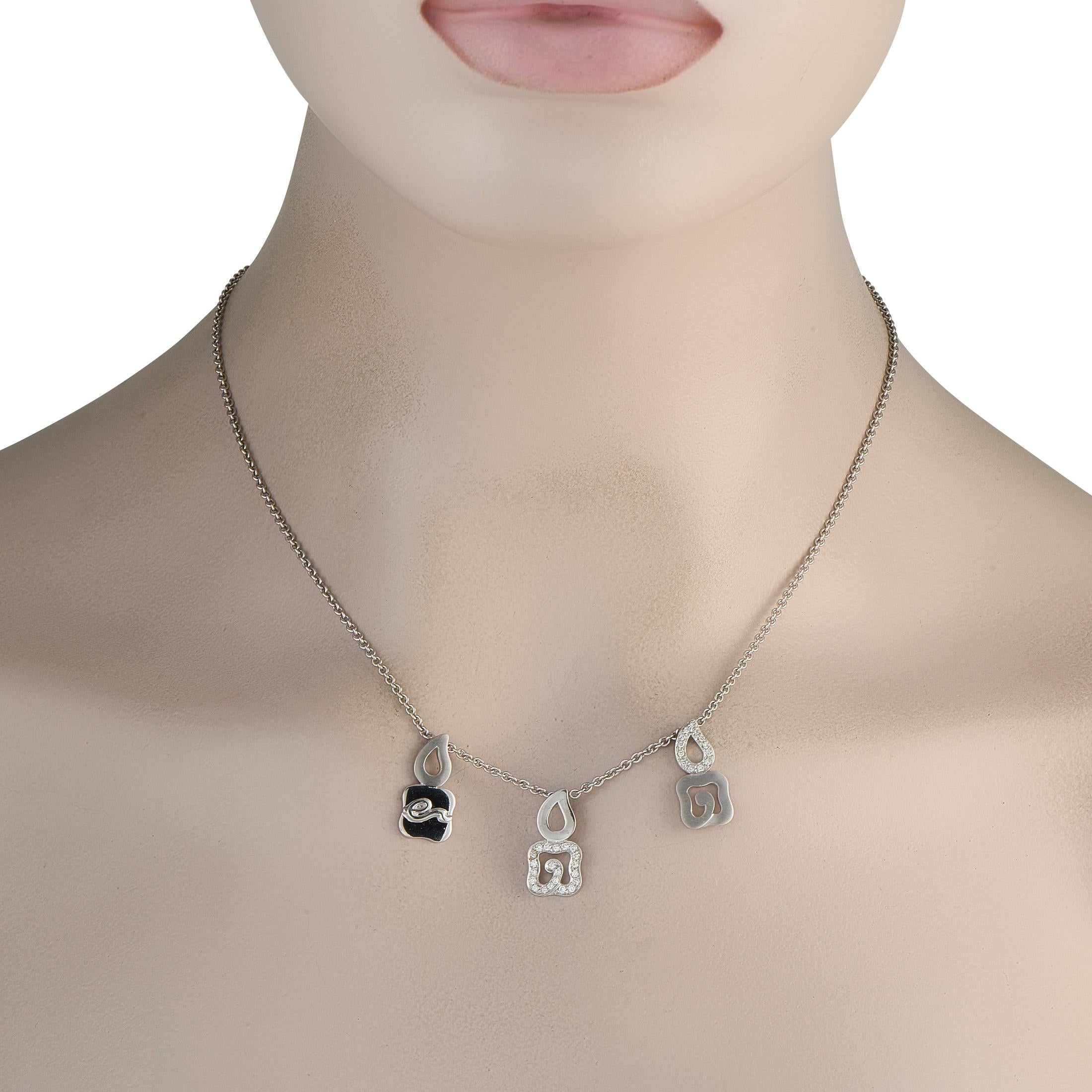 Like all La Nouvelle Bague accessories, this necklace blends traditional design techniques with an evocative, contemporary sense of style. Suspended from a delicate 17.5 chain, a trio of small pendants make a subtle statement. Diamonds with a total