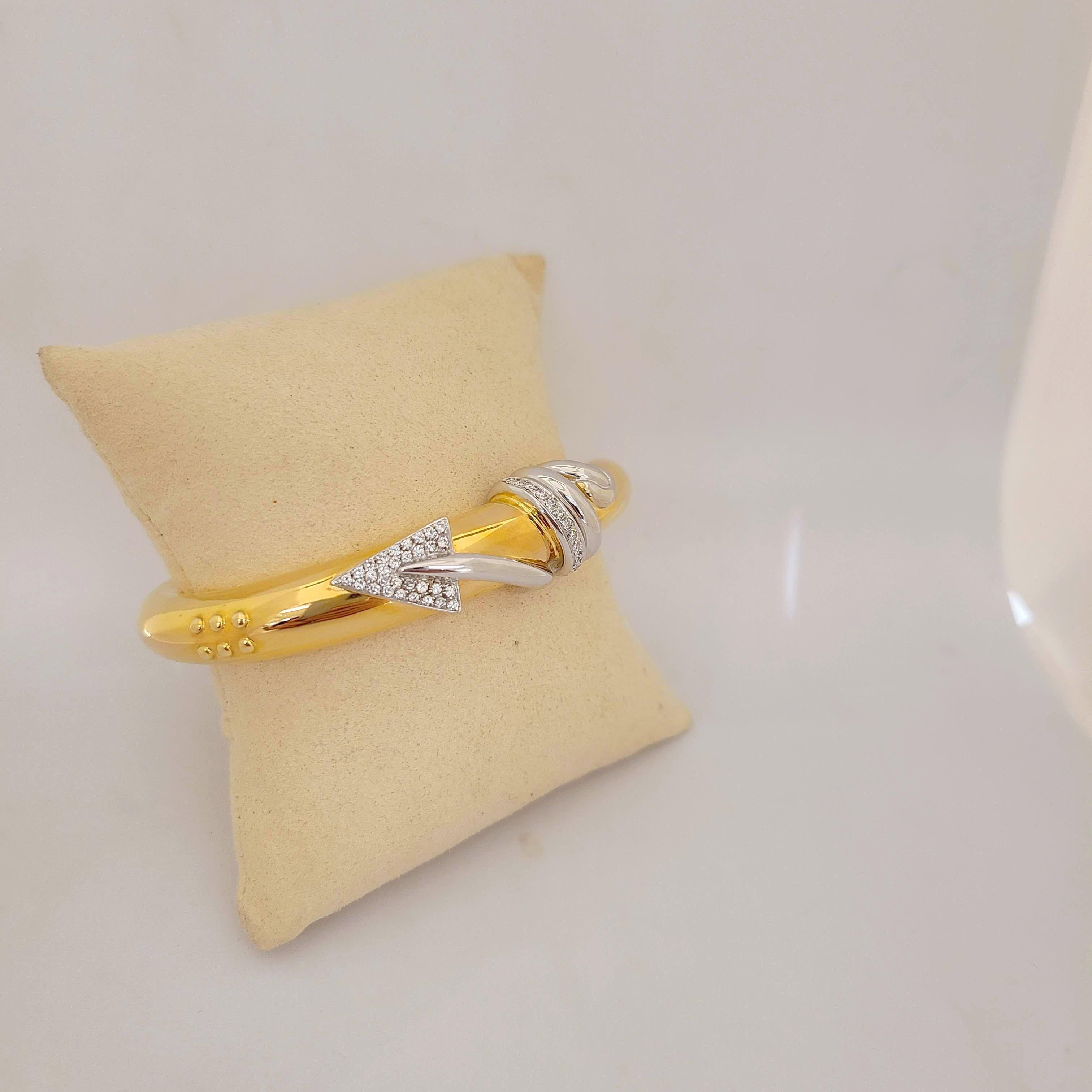 This magnificent 18 karat yellow gold bracelet is designed by the world renowned Italian company La Nouvelle Bague. They are known for their exquisite craftsmanship, marrying the classic with the modern.
This bangle bracelet is designed in a hi